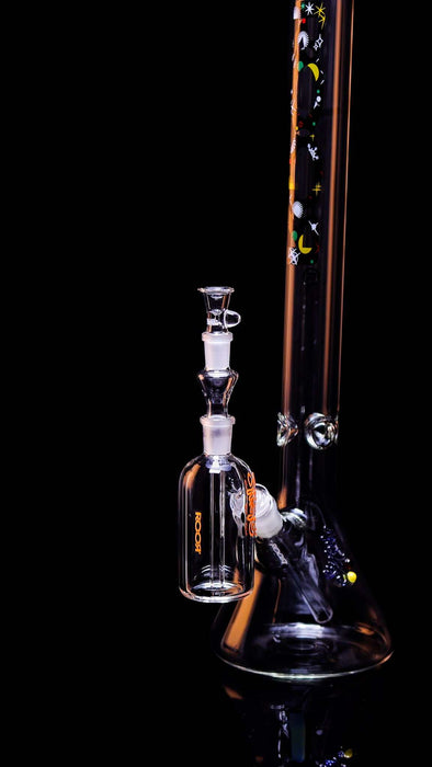ROOR® Classic Ash Catcher 14.5mm Joint glass accessory with decorative decals attached to a glass bong.