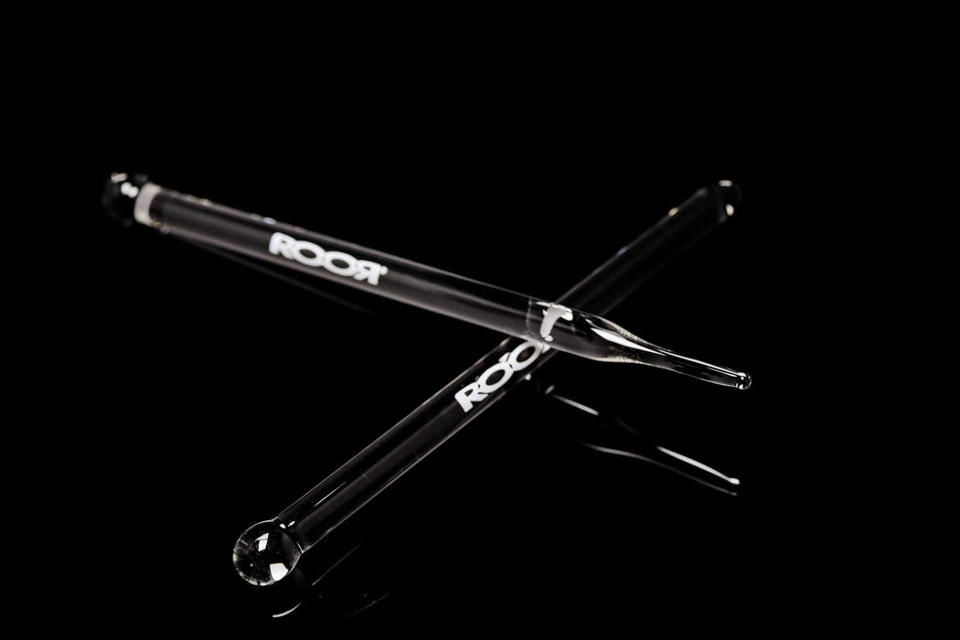 ROOR Glass Wand with choice of round or pointed tip on black background.