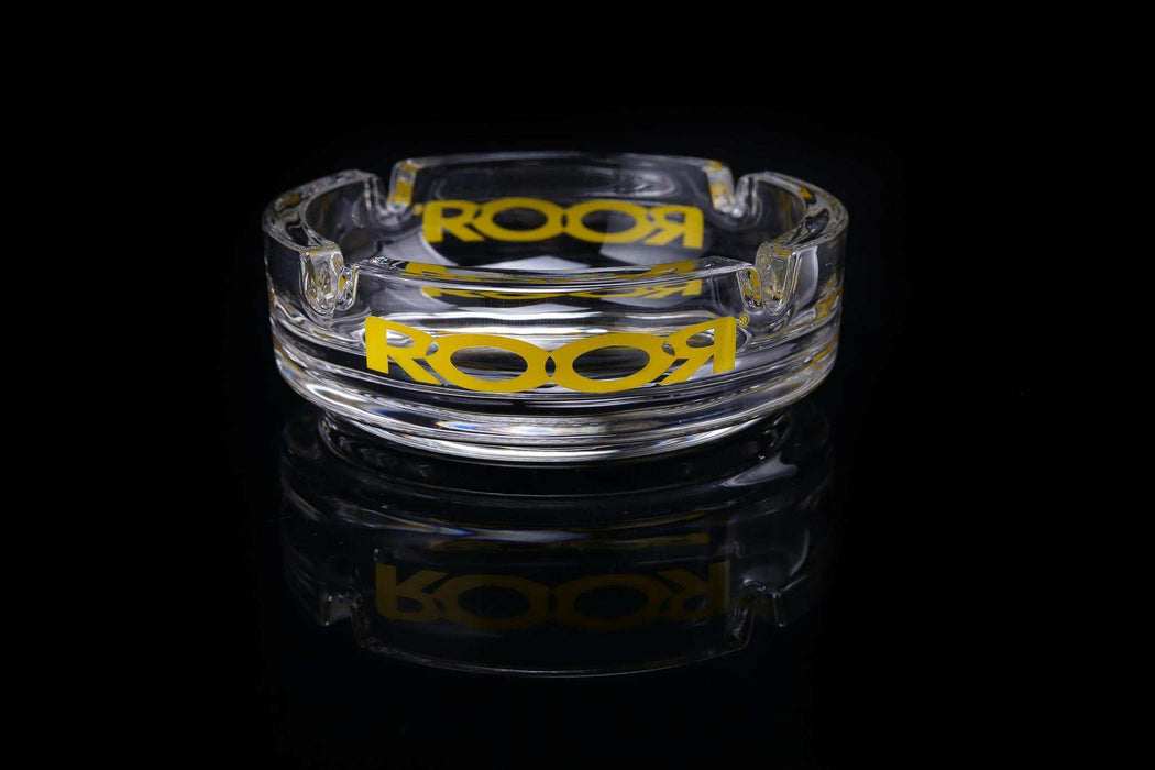 ROOR Collector Glass Ashtray with yellow decal on black background.