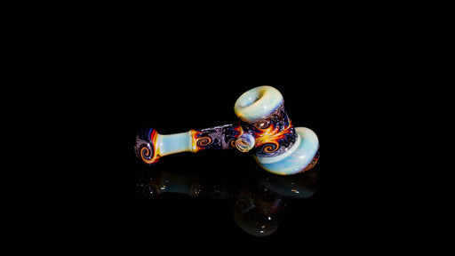 ROOR Glass pipe with colorful worked design on a black background