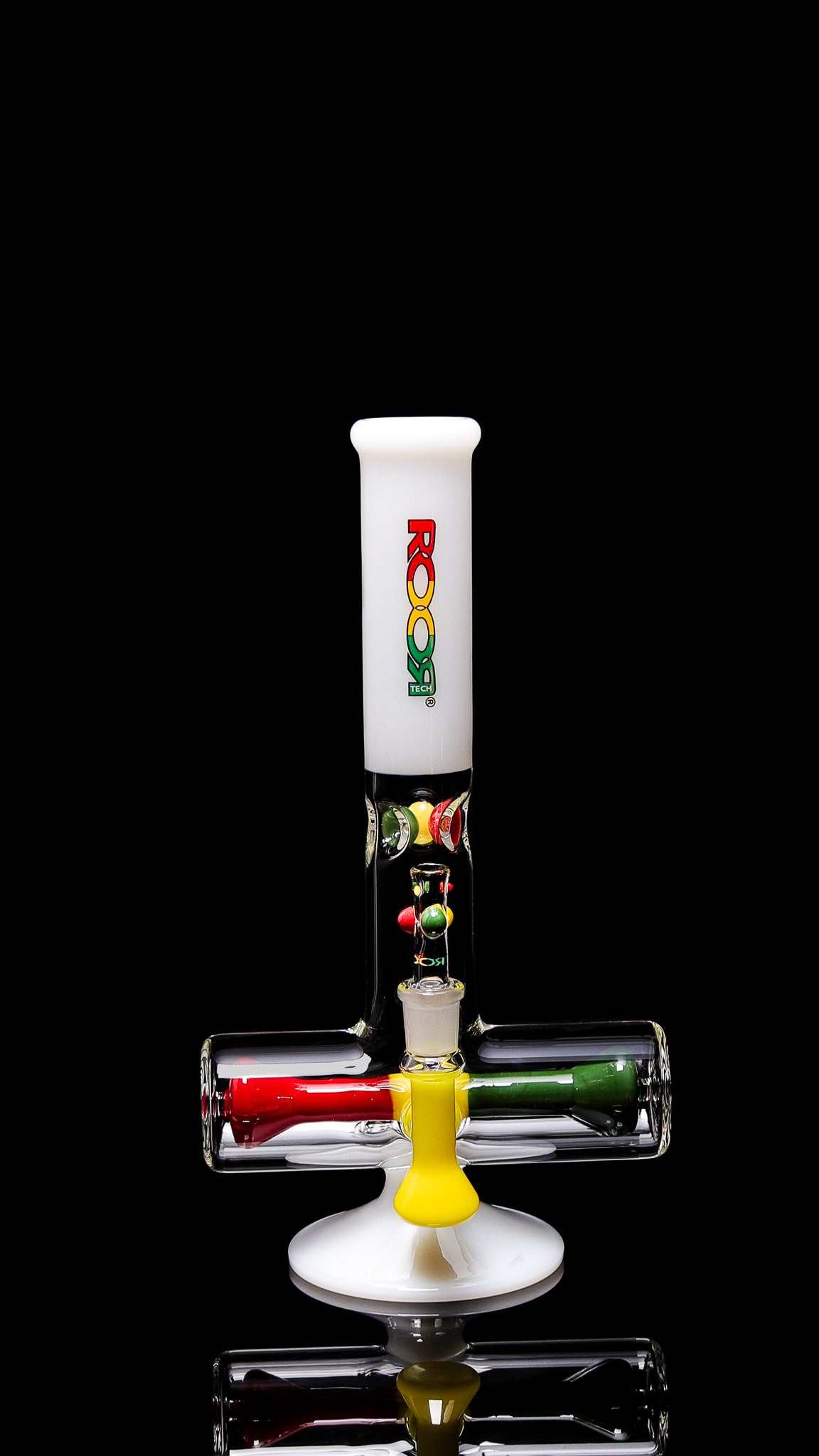 ROOR® Tech 12" Mini Inline White Rasta Edition glass with colorful accents on a black background.