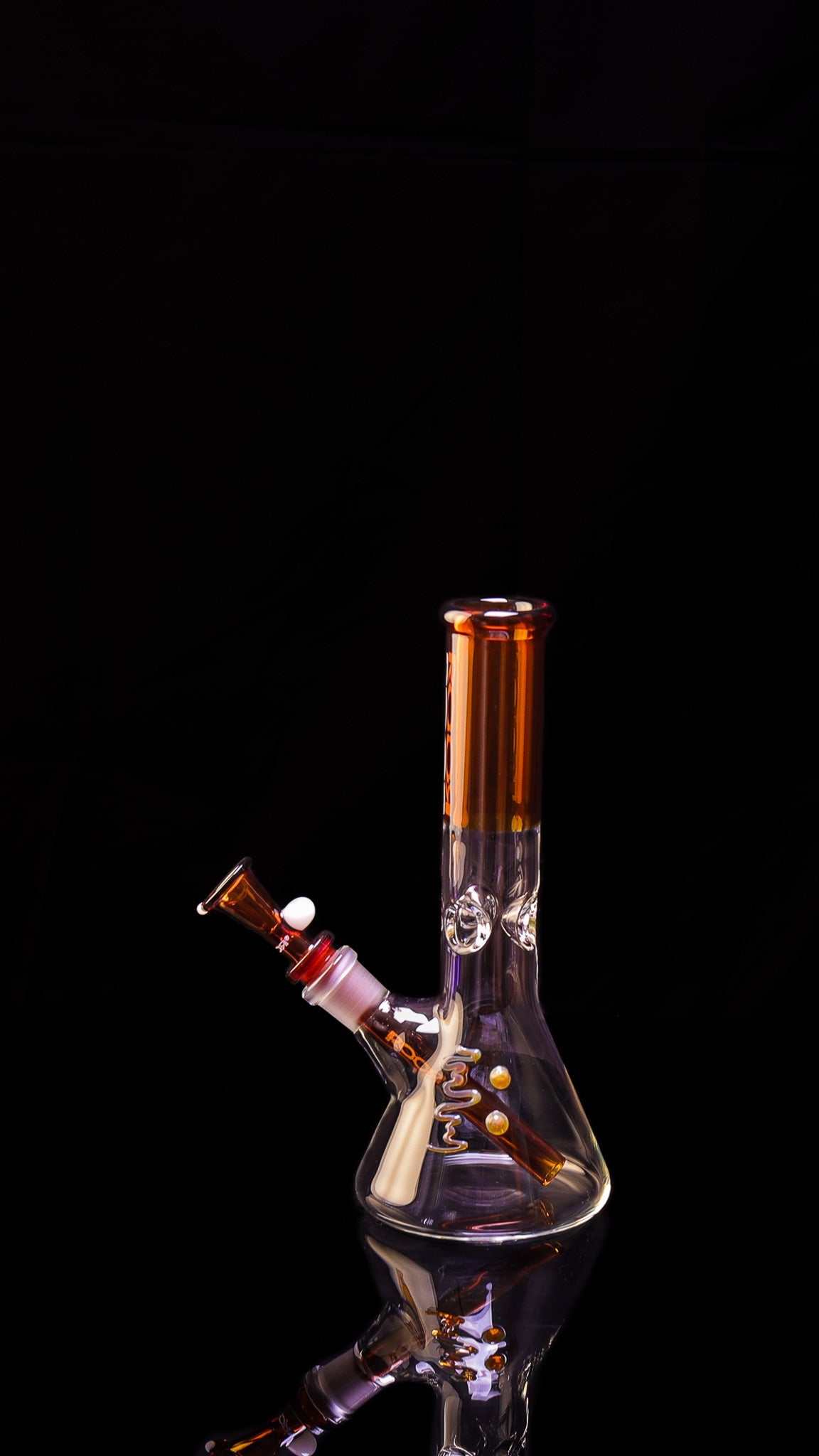 ROOR® Mini 10" Beaker 38x4mm Amber with ice pinches and amber accents on black background.