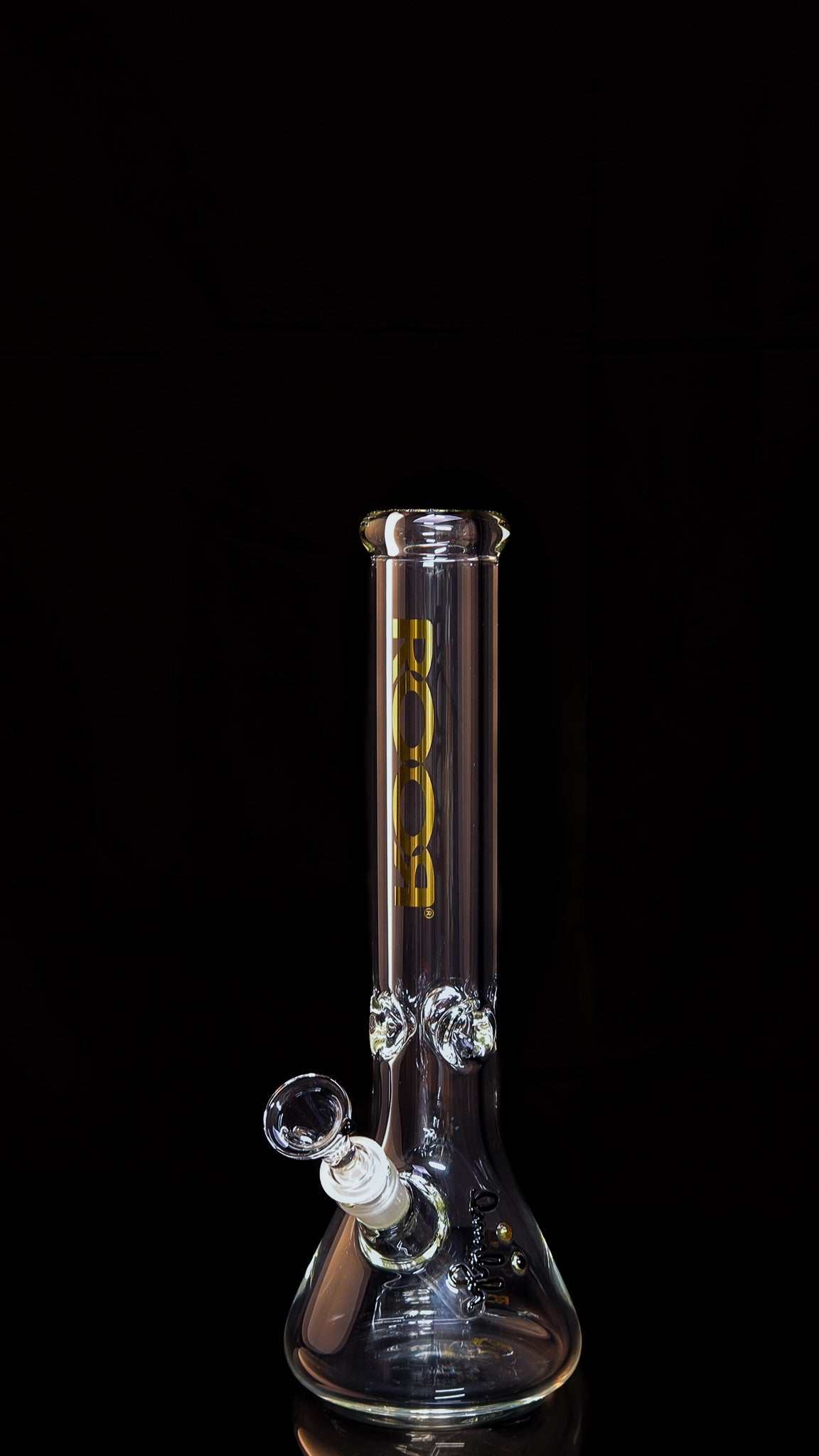 ROOR Classic 14-inch beaker bong with gold decal and matching accessories including downstem, funnel bowl, and authentication seal