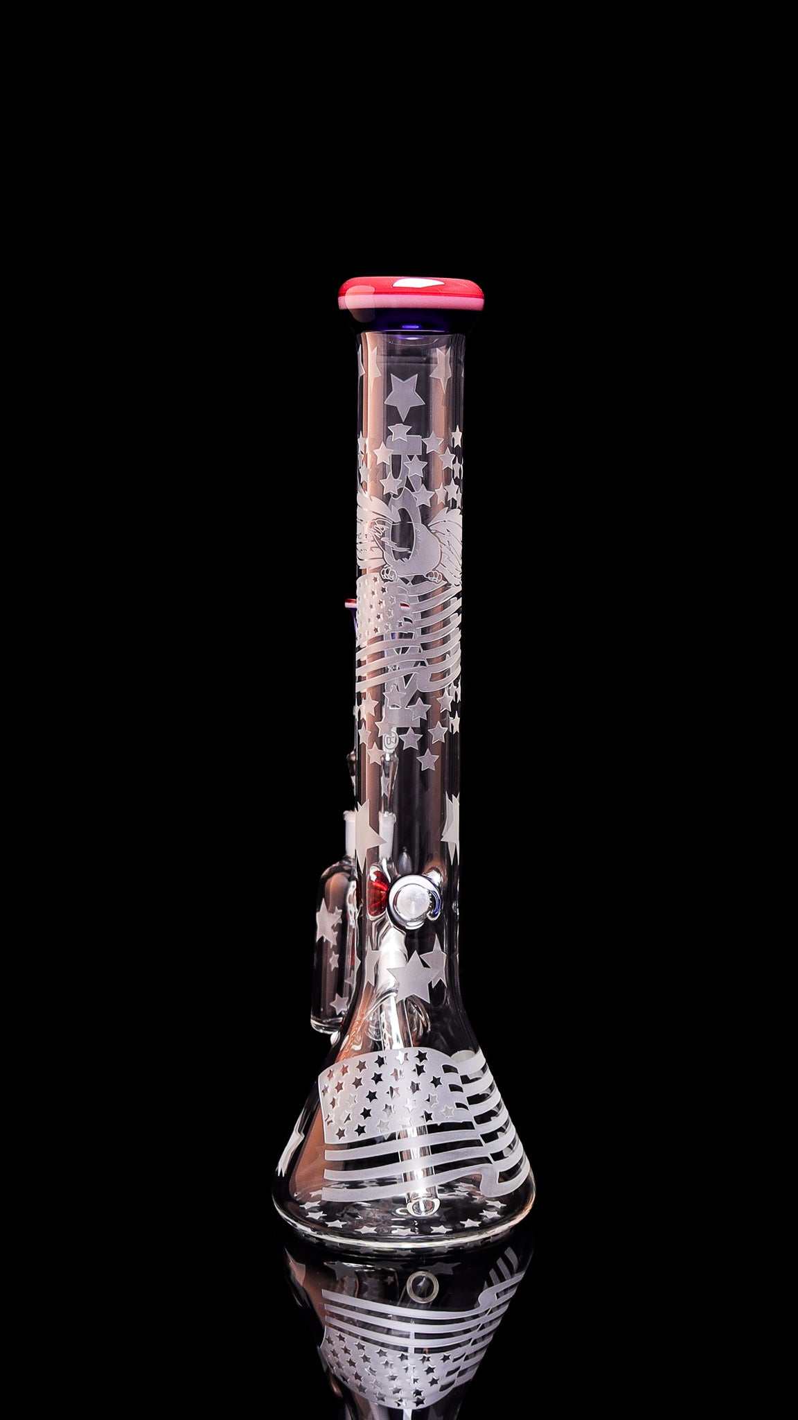 ROOR Strains Presidential 18-inch beaker bong with sandblasted American flag design and red mouthpiece and matching ashcatcher on black background