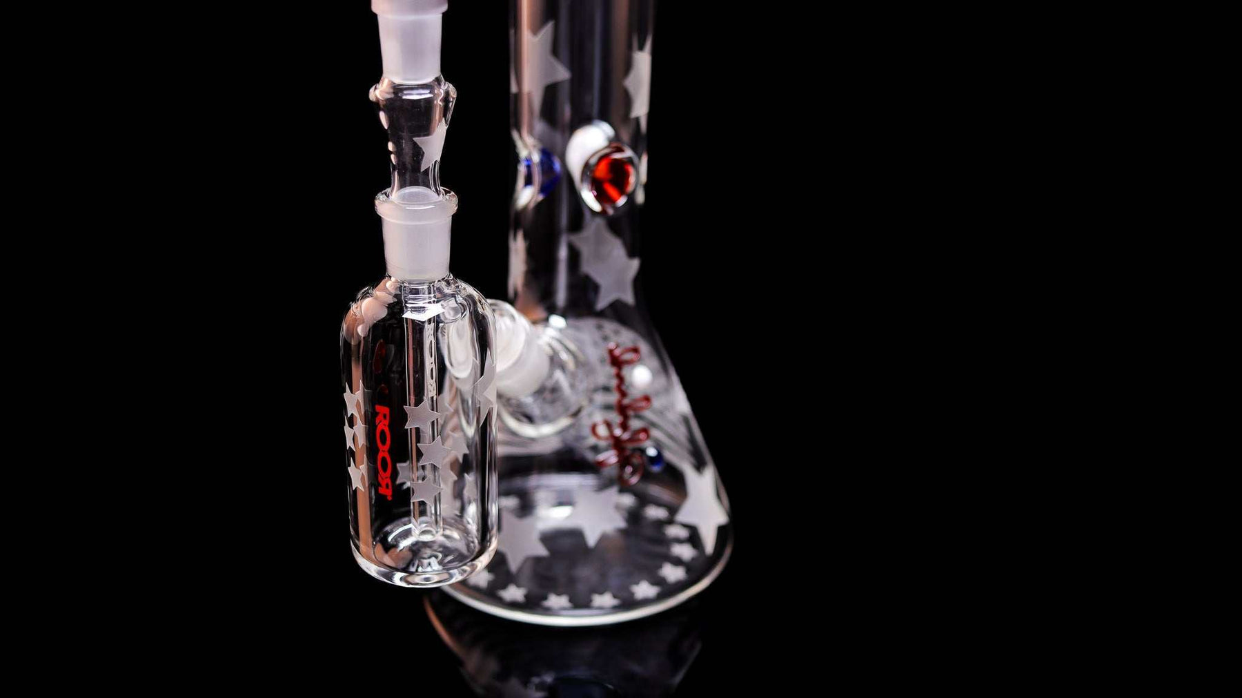 ROOR® Strains Presidential 18” beaker with matching sandblasted 14mm ashcatcher featuring star designs and red accents on black background