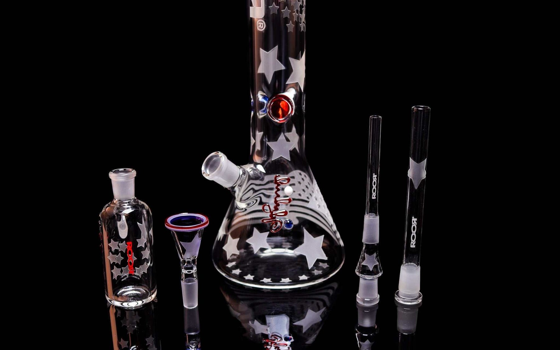 ROOR® Strains Presidential 18” beaker glass with star patterns and matching ashcatcher 14mm joint set on black background