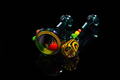 ROOR® Custom Worked Hand Pipe Jade Chillum Set with Rasta Swirl design on black background.