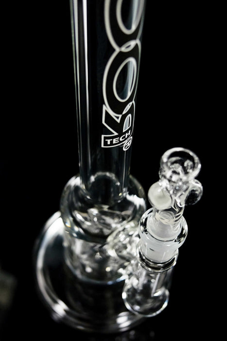 Close-up view of clear ROOR Tech 14” Bubbler glass pipe with black and white decal on neck