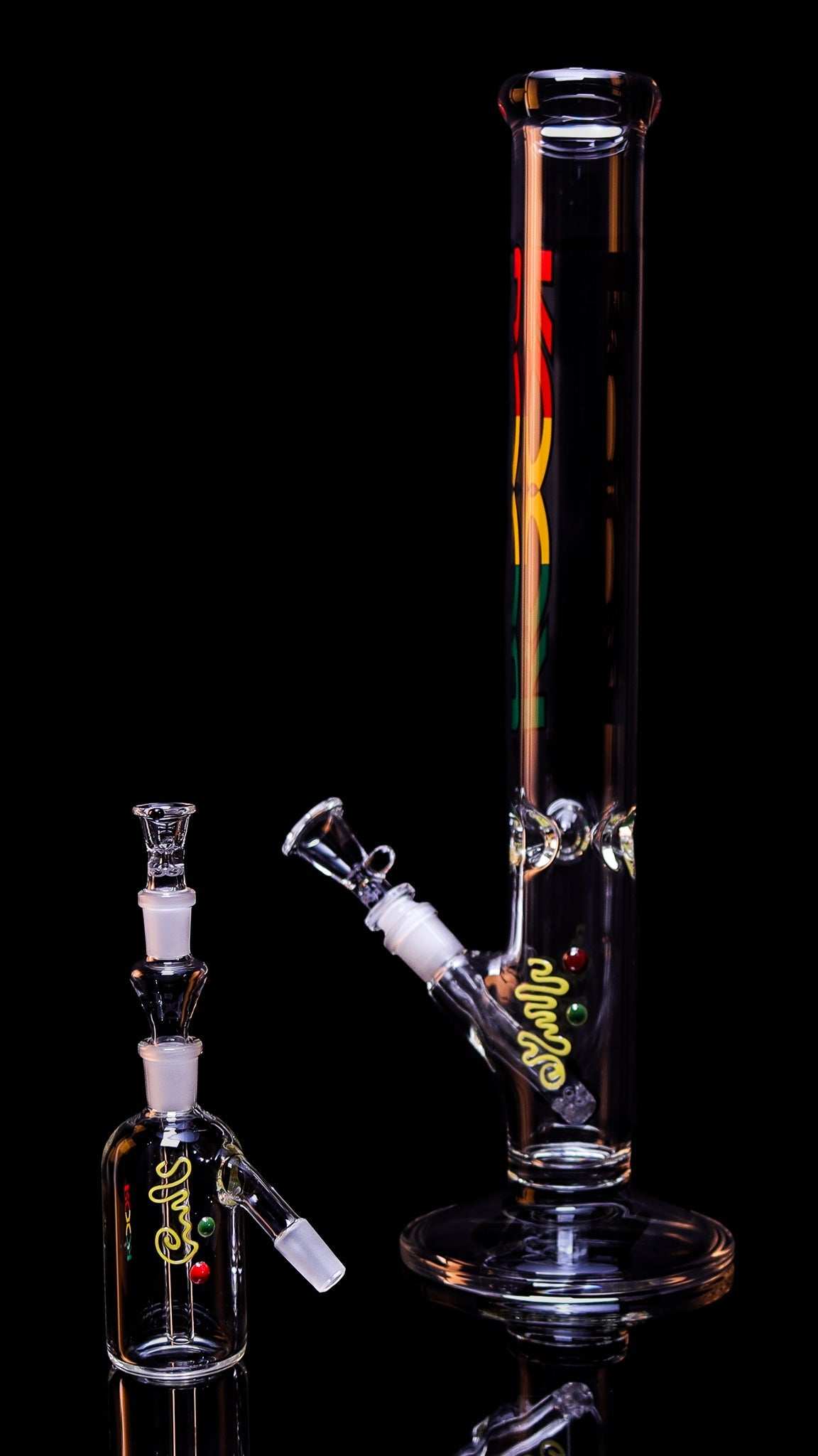 Exclusive ROOR 18 inch straight glass water pipe with RASTA label and matching ashcatcher with 14mm joint.