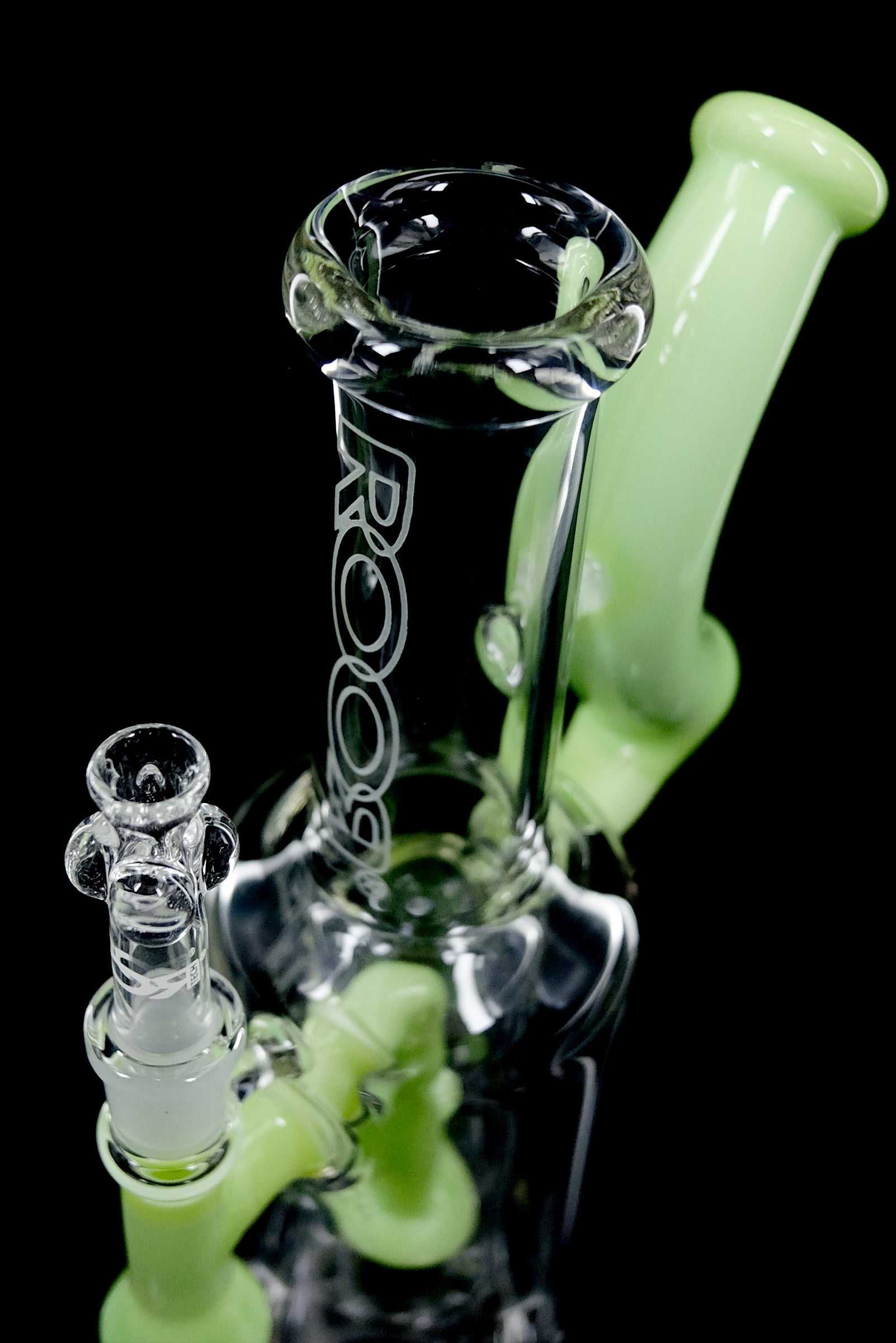 ROOR® 1130 Beaker Green glass water pipe with clear body and green mouthpiece on black background