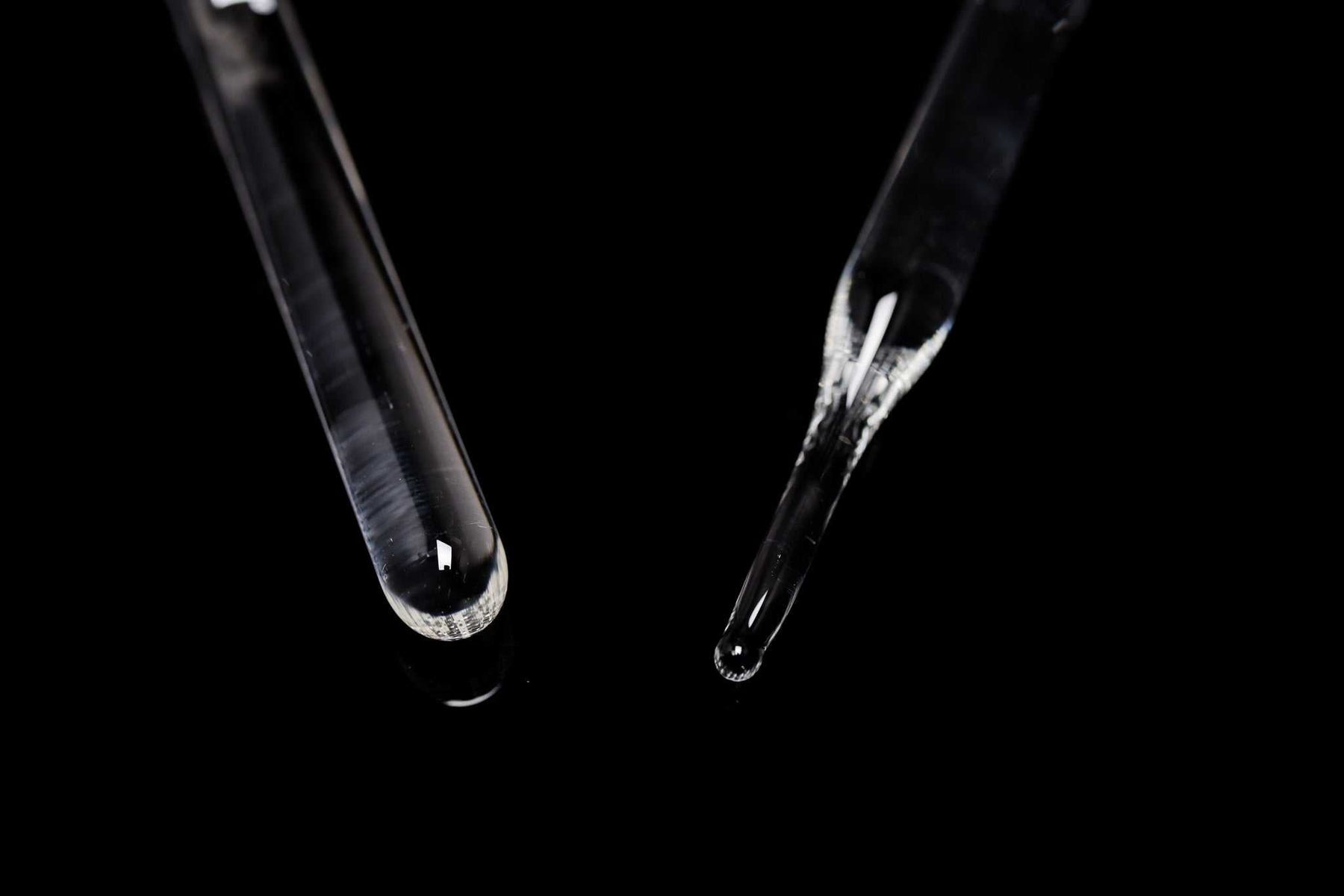 ROOR Glass Wand with round and pointed end tips on black background.