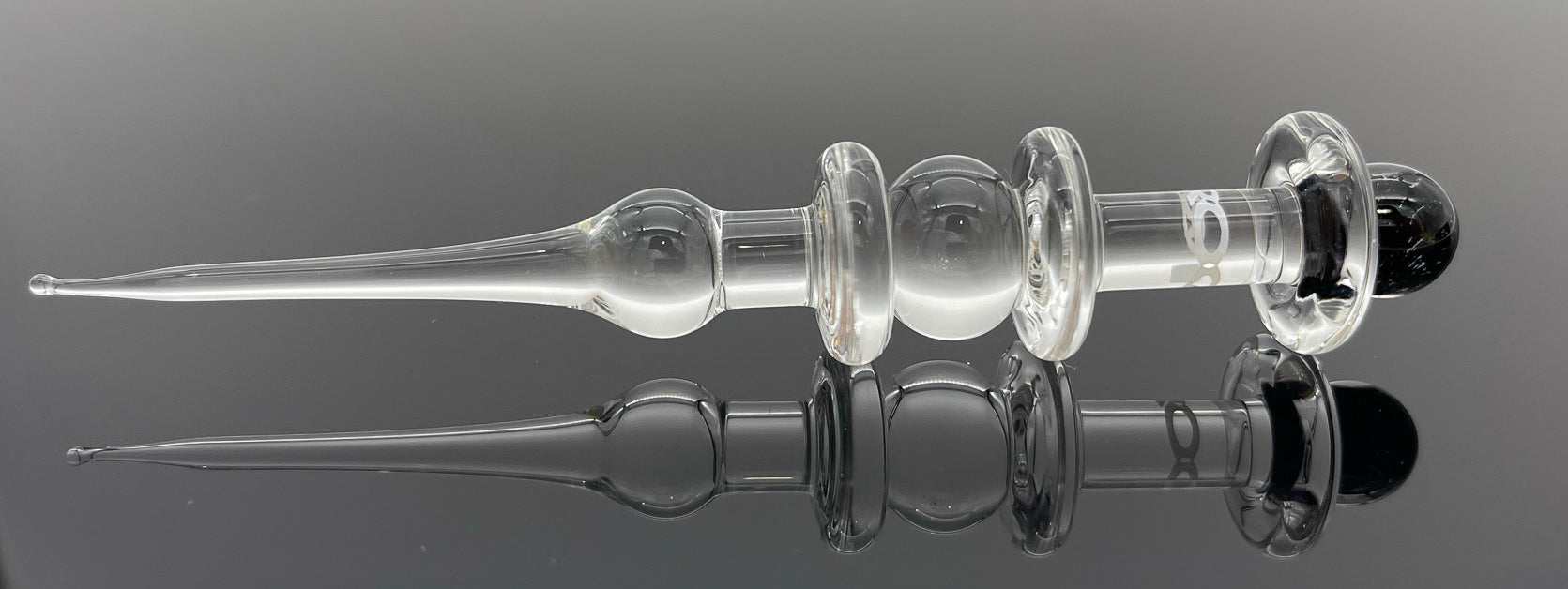 ROOR Glass Poker Dichro with white logo decal and round ridges for grip.