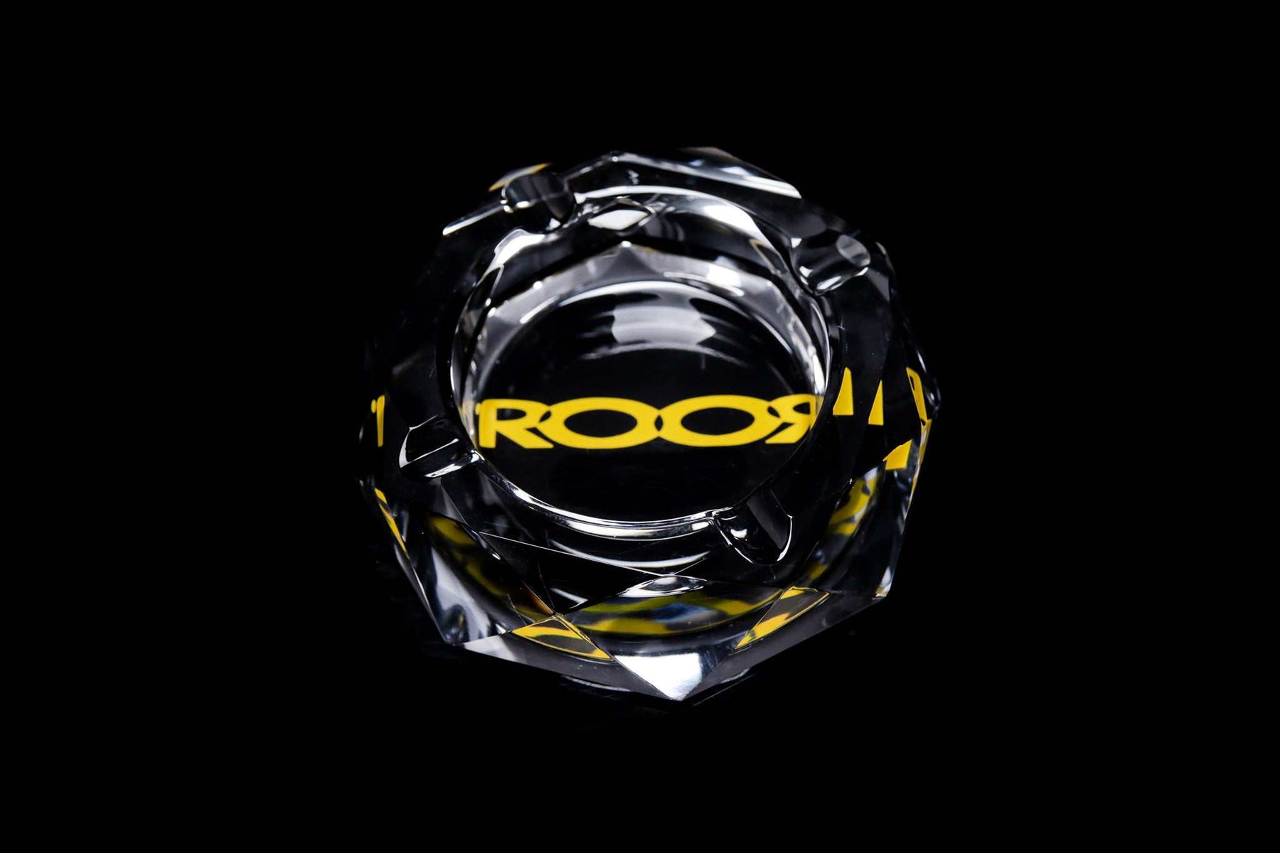 ROOR glass crystal cut ashtray with yellow color decal on black background