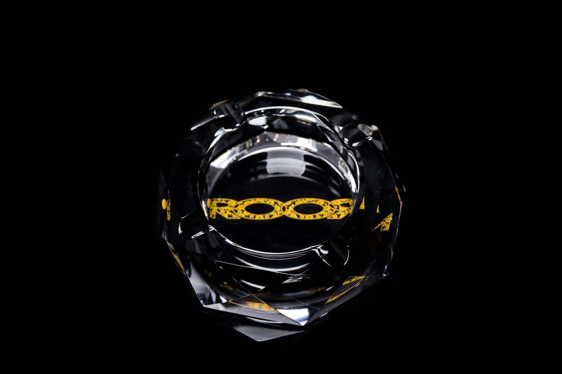 ROOR glass crystal cut ashtray with yellow color decal on black background