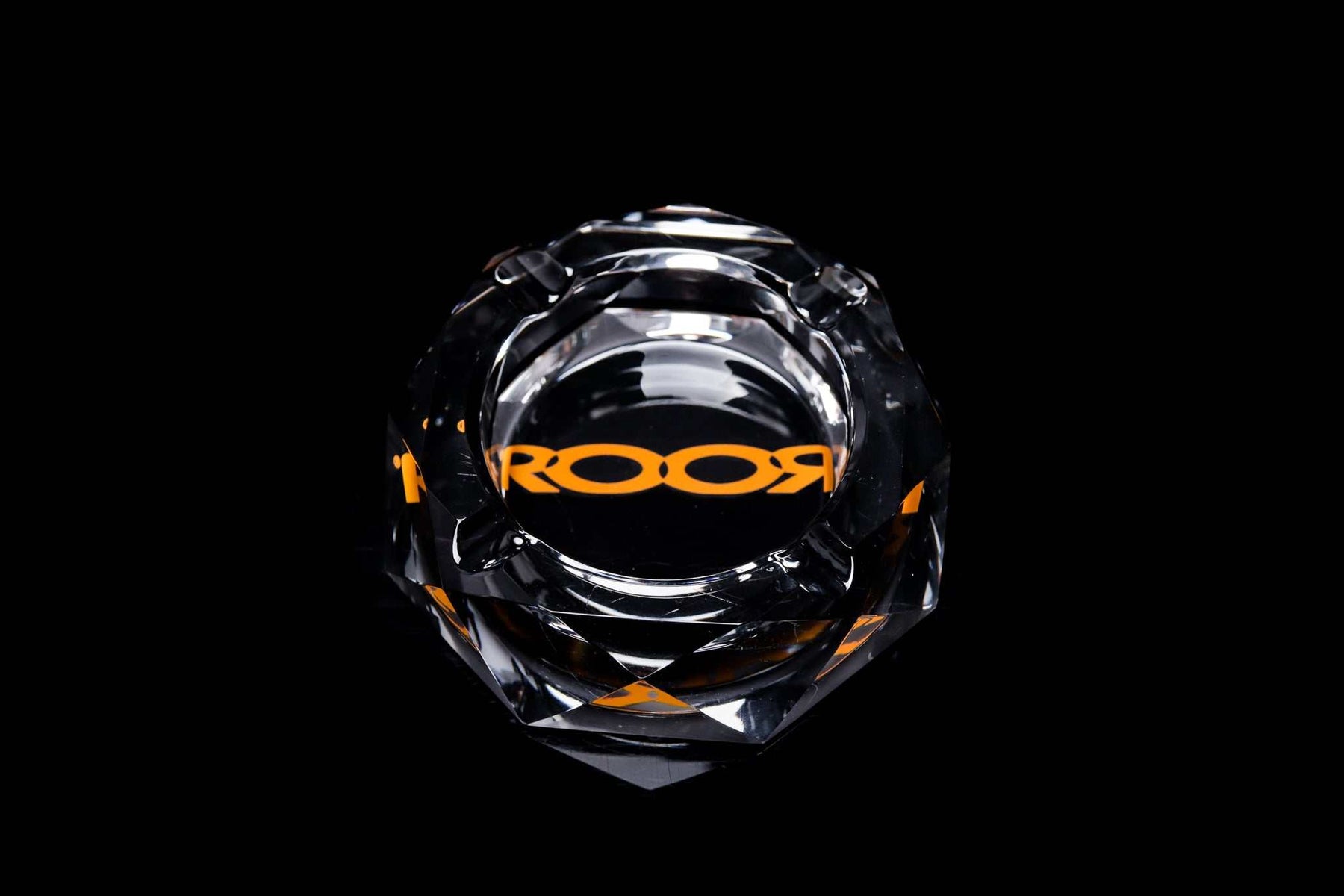 ROOR glass crystal cut ashtray with orange color decal on black background