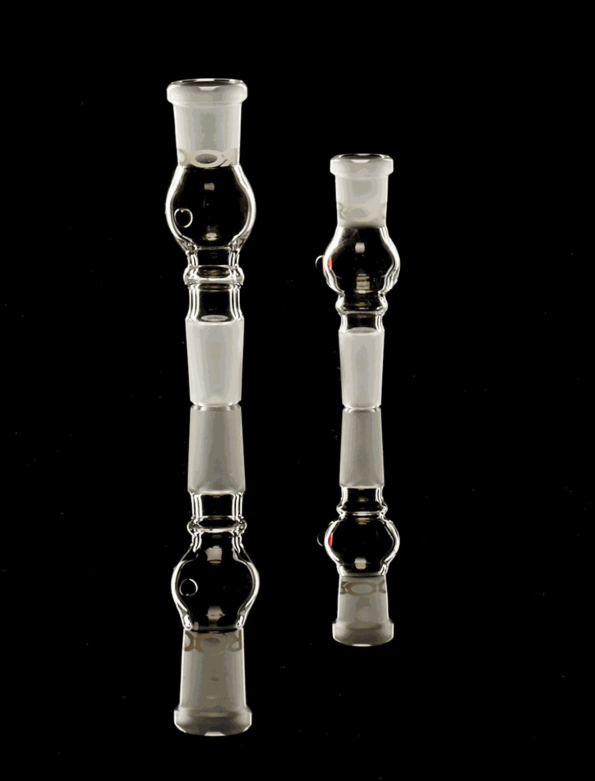 ROOR® Activated Carbon Adaptor 18.8mm glass pieces on reflective surface.