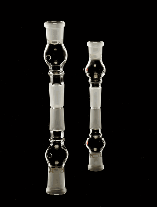 ROOR® Activated Carbon Adaptor 18.8mm glass pieces on reflective surface.