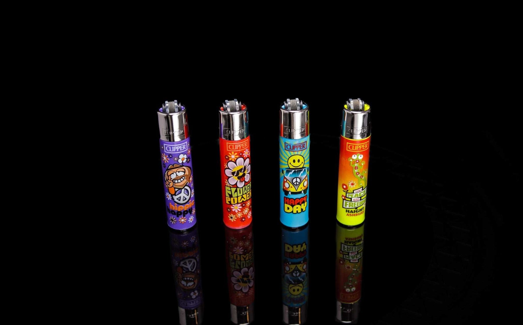 Set of four colorful Clipper lighters with hippie design featuring peace and freedom themes on black background