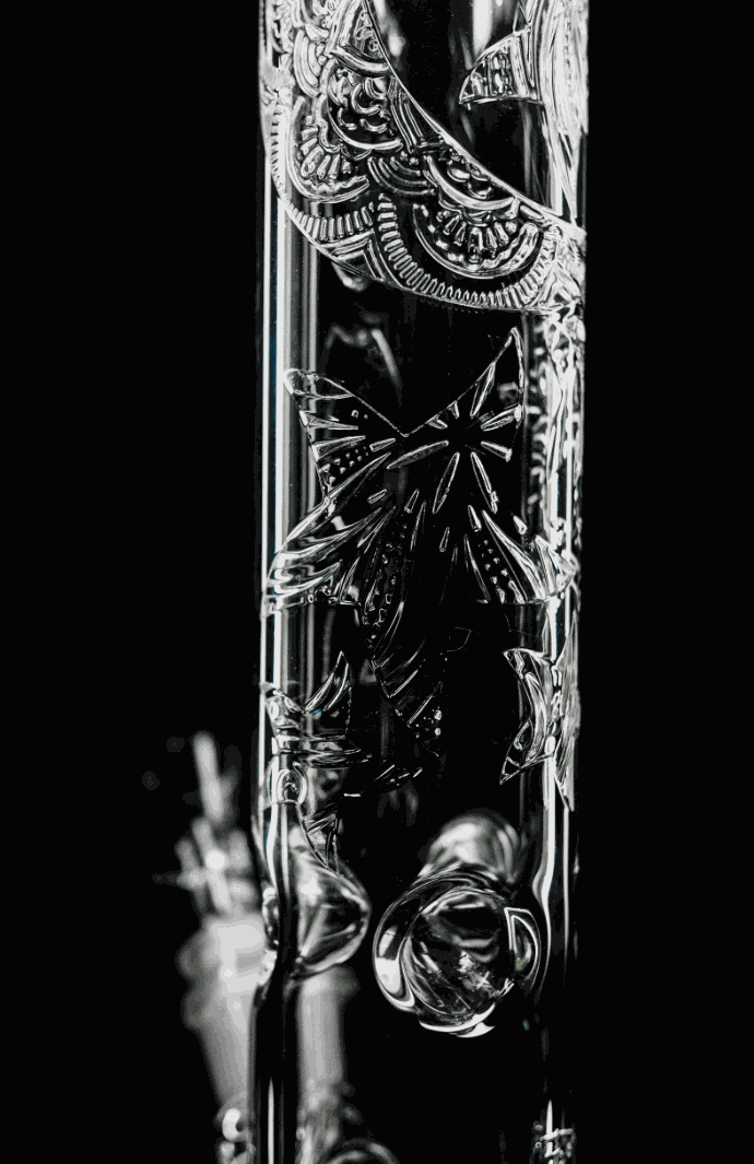 Close-up of ROOR® Sandblasted Flame Polished 14" Straight 50mm glass tube with intricate designs