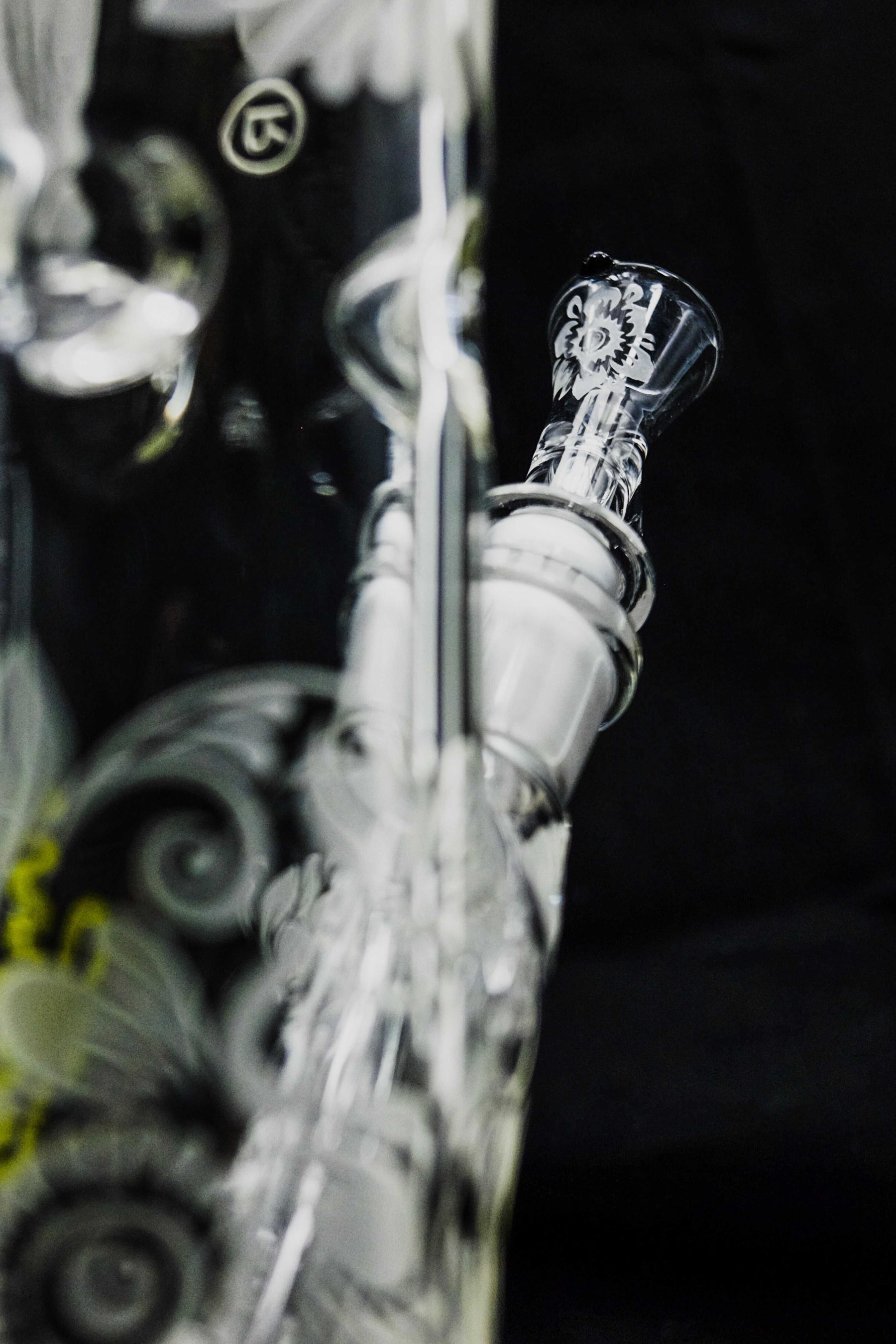 Close-up of ROOR® Sandblasted 14" Straight 50x5mm Big Daisy glass pipe with intricate floral design