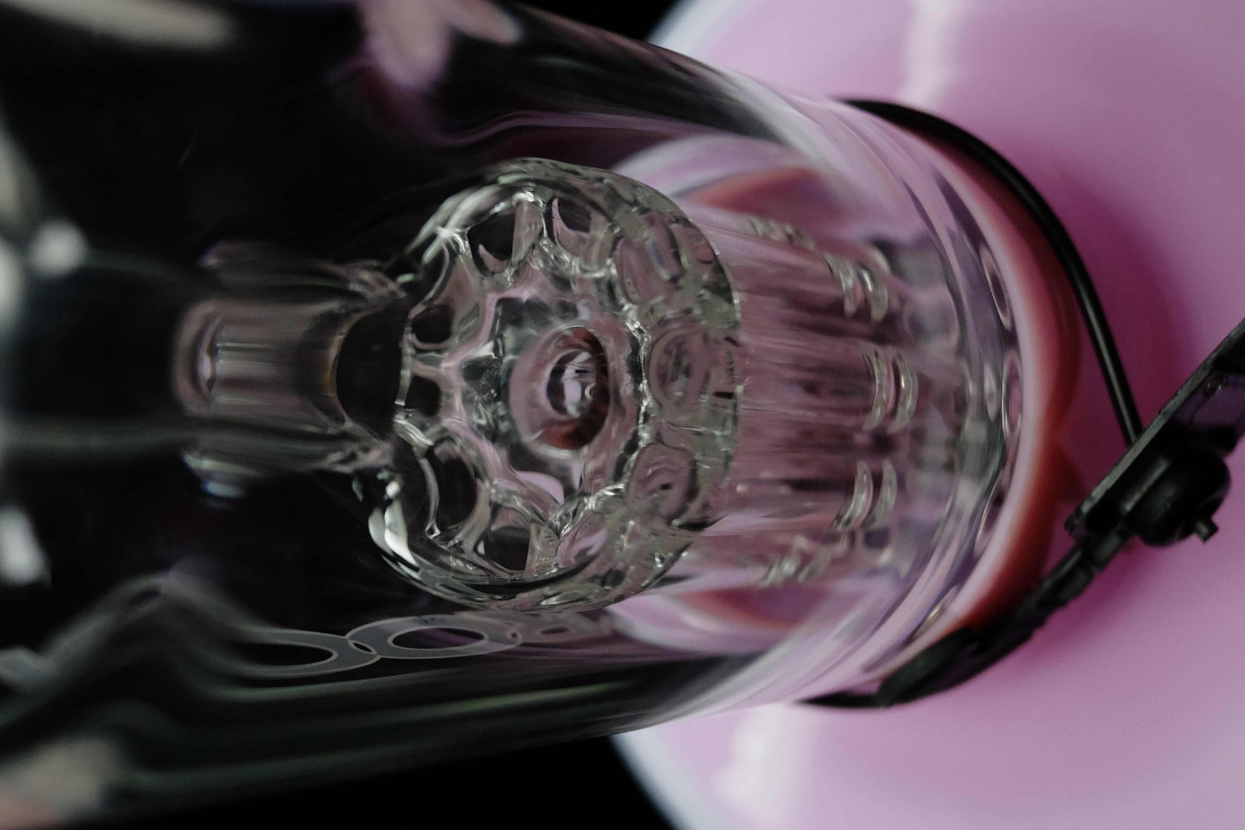 Close-up view of ROOR Tech Fixed 10-Arm Tree percolator inside pink and white bubbler glass piece