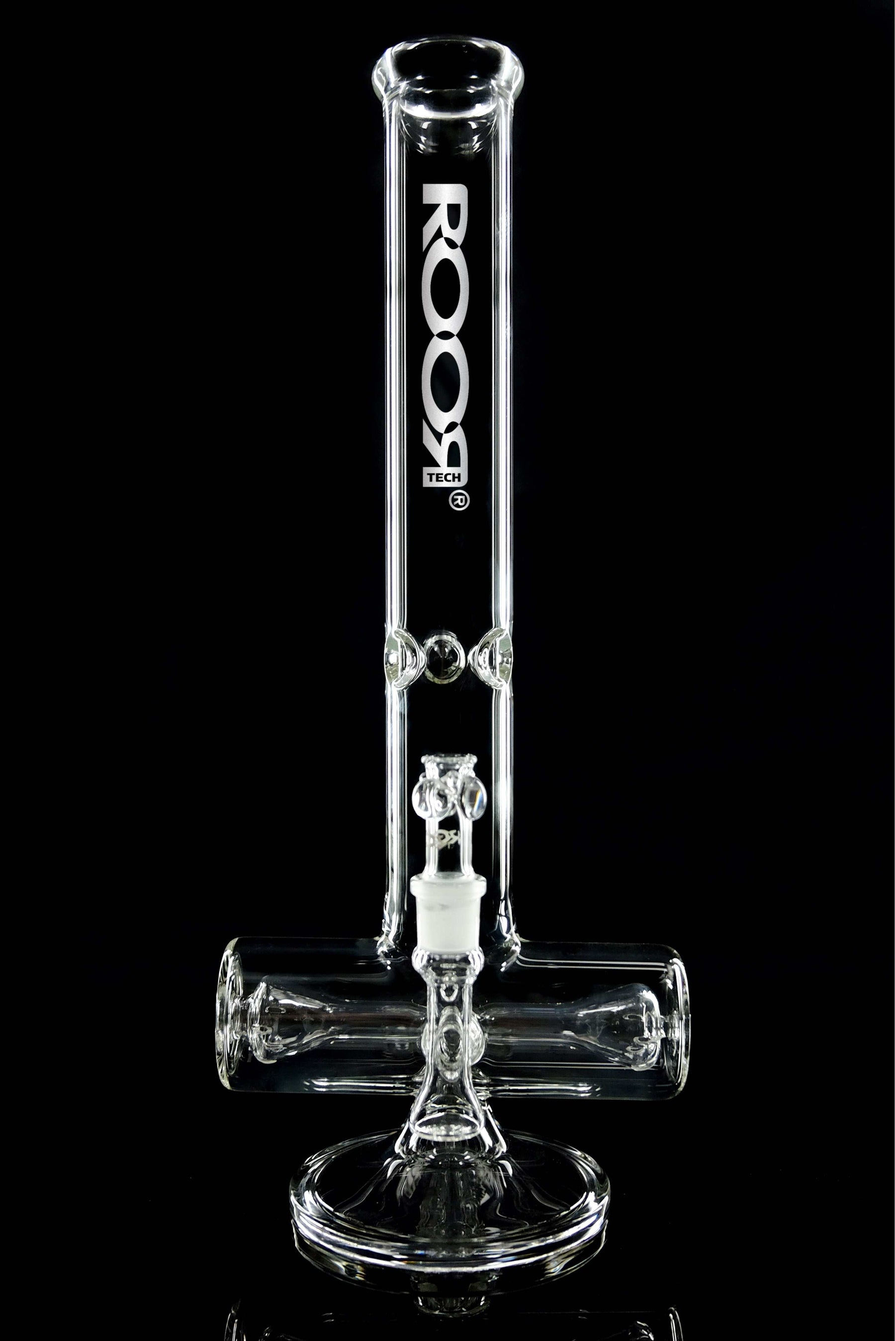 ROOR Tech 18” Inline 50x5mm Clear glass water pipe with built-in ash catcher and ice pinches for cooling.