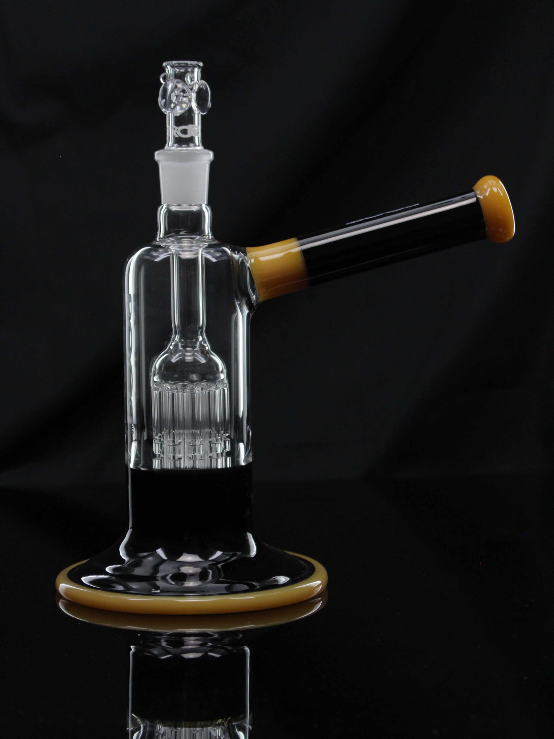 ROOR Tech Fixed 10-Arm Tree Bubbler in Black and Tangie Color with glass percolator and stemless design on black background