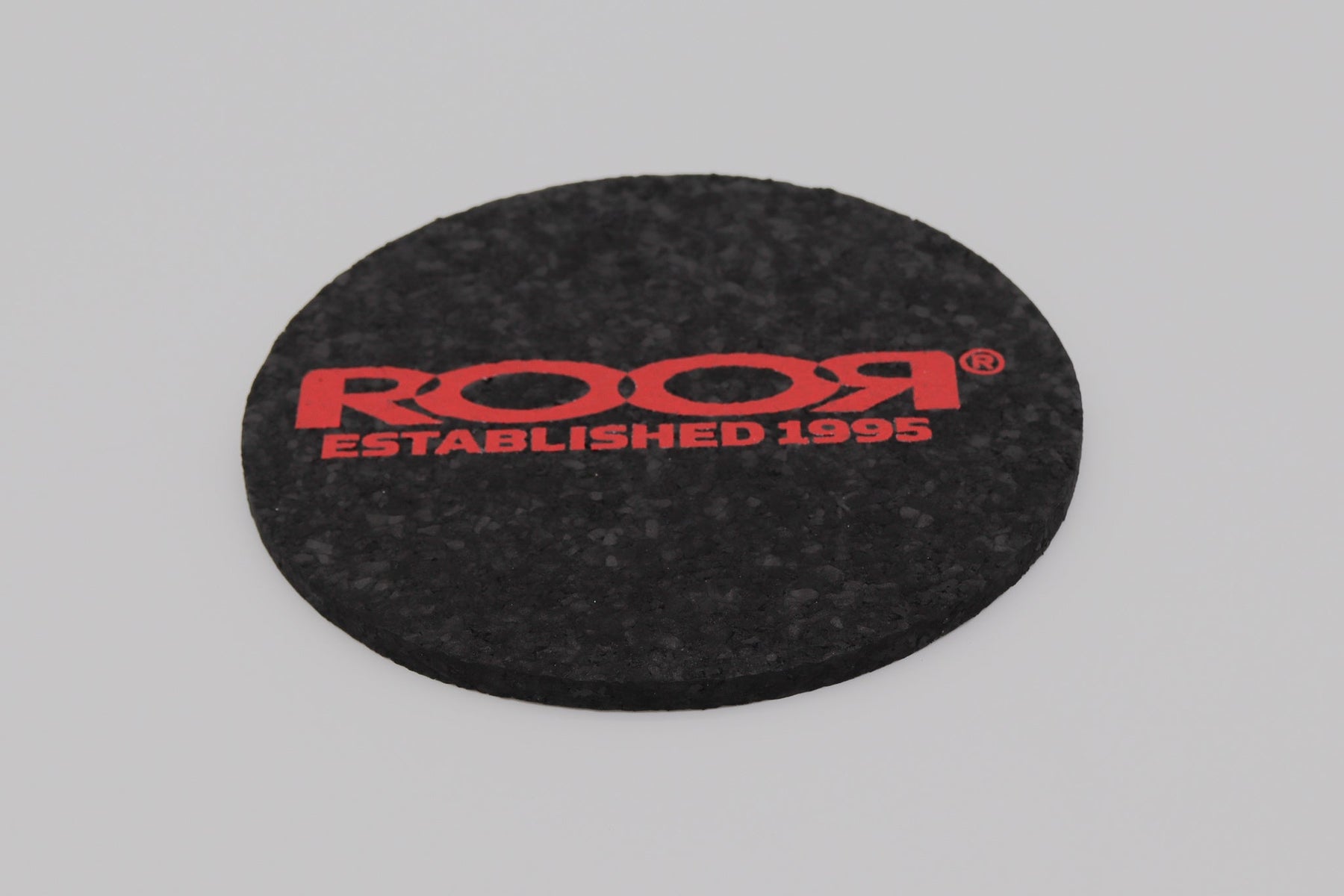 ROOR Coaster Round black rubber coaster with red logo and Established 1995 text