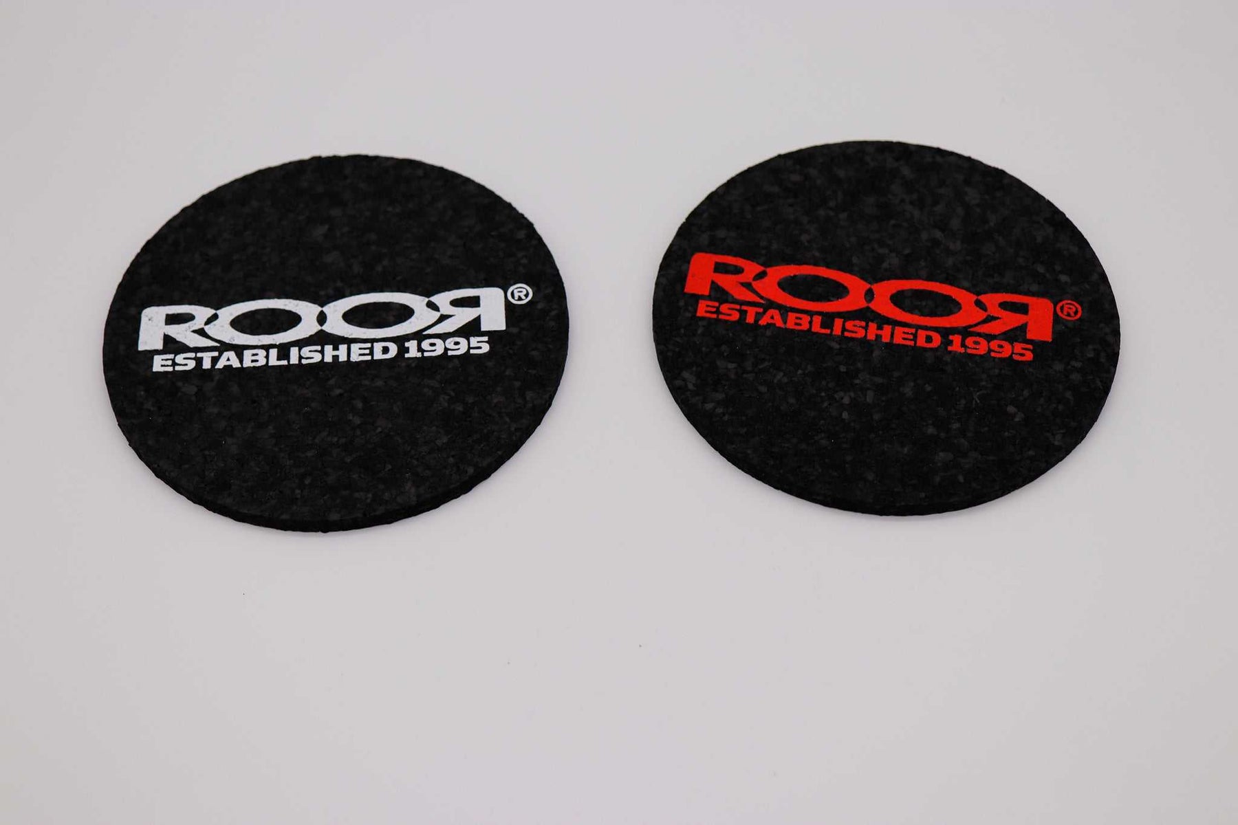 ROOR Round Coaster Bundle with red and white logo design on black rubber coasters.