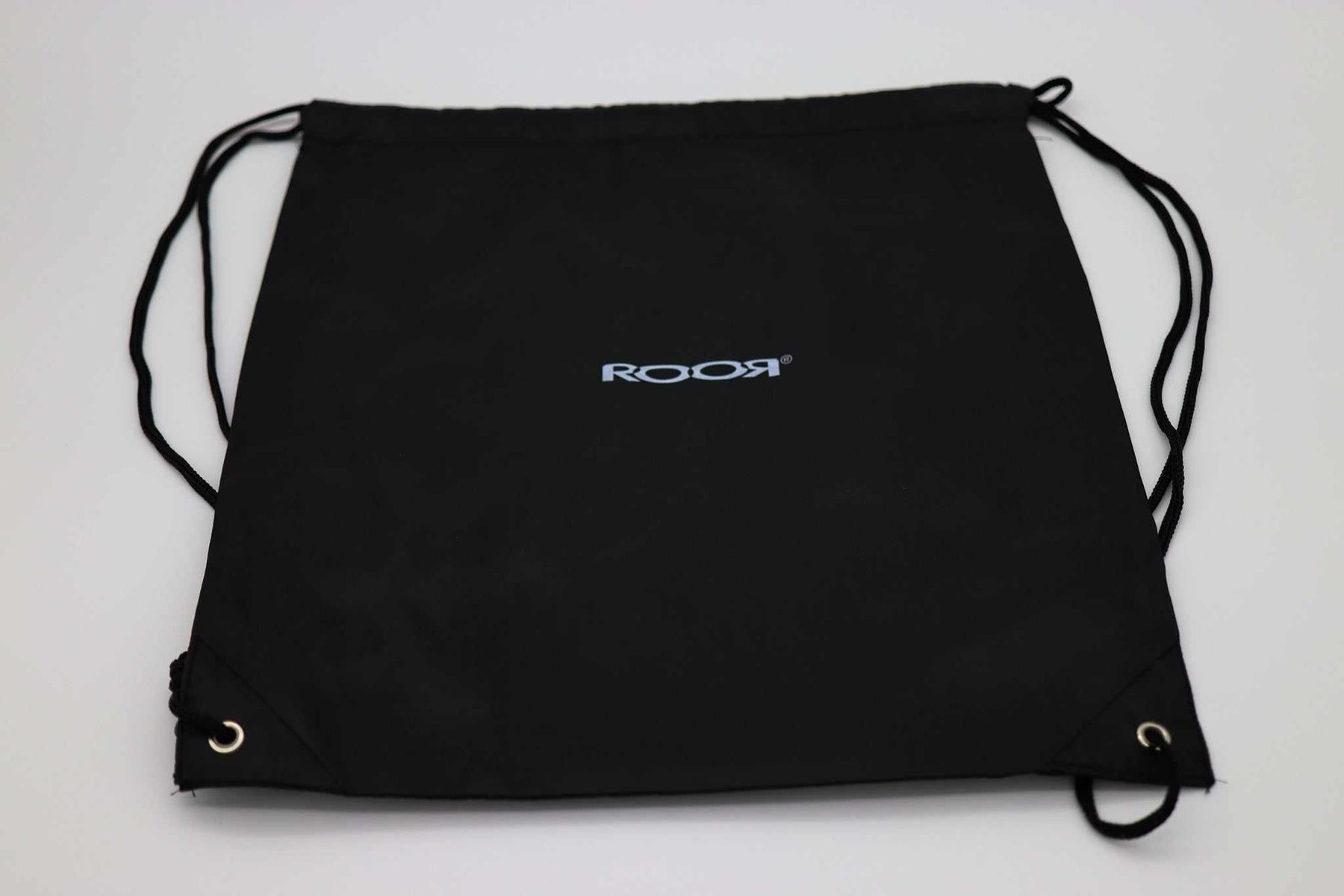 Black ROOR drawstring bag with logo, 14.5" x 12", includes collectible sticker packet.