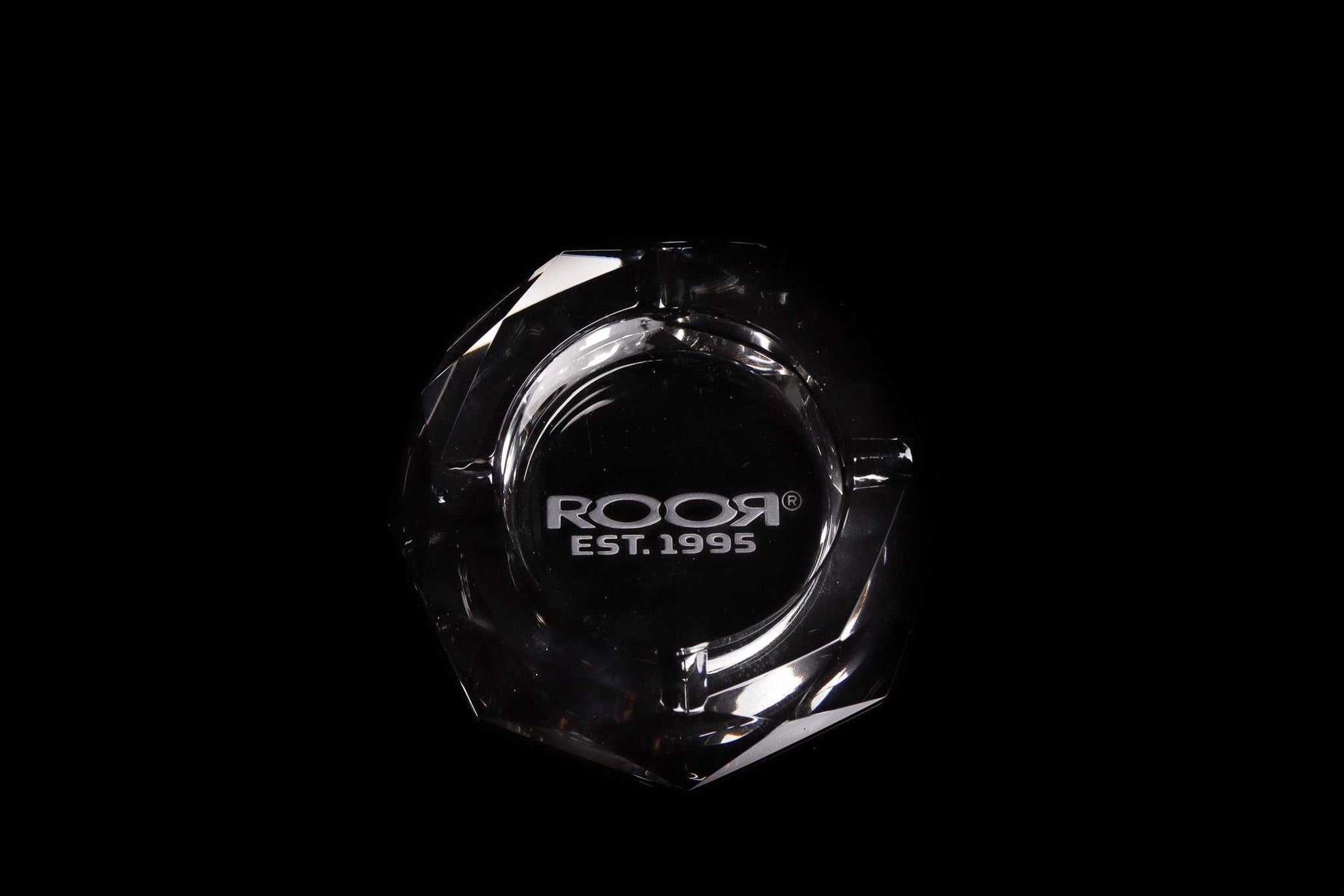 ROOR Glass Crystal Cut Ashtray with hand-cut crystal design and engraved logo on black background