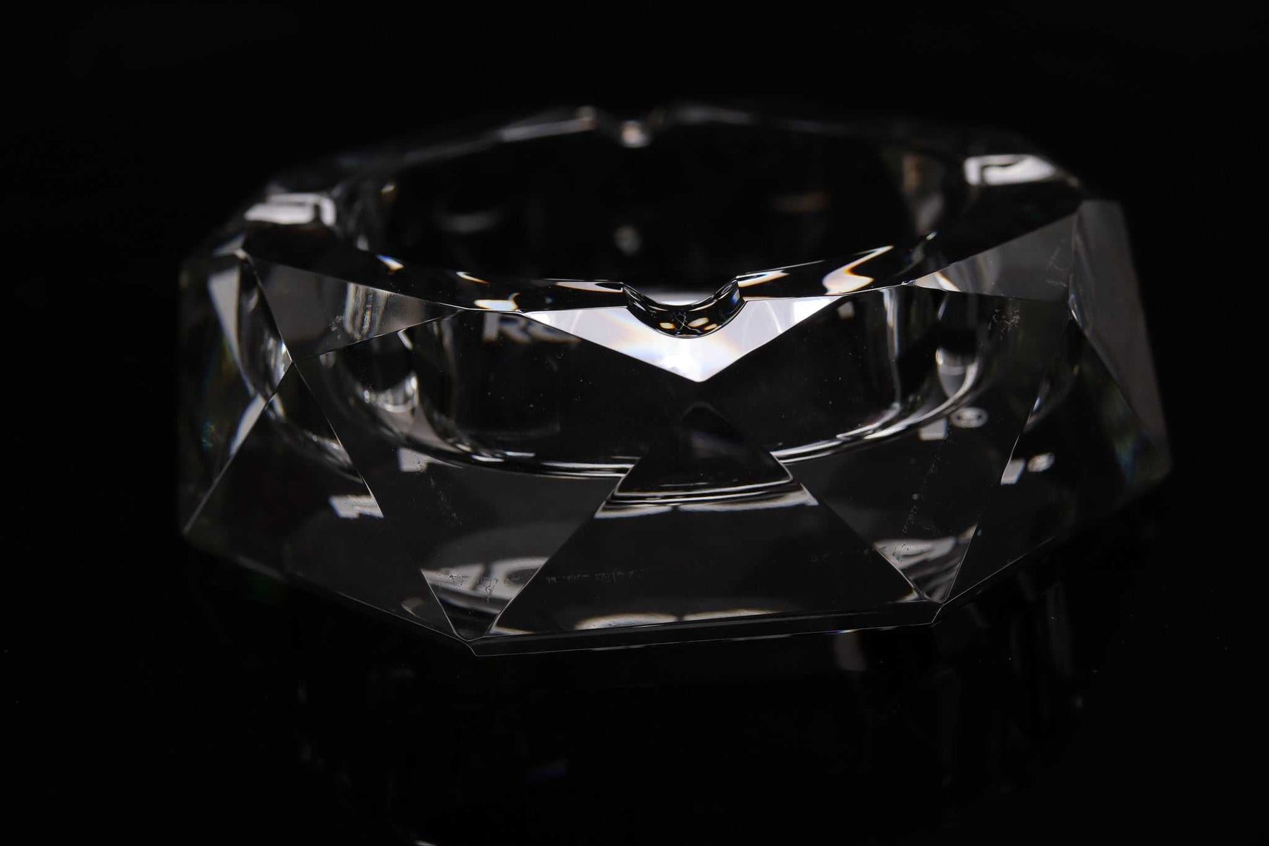 ROOR Glass Crystal Cut Ashtray hand-cut clear crystal with faceted design on black background