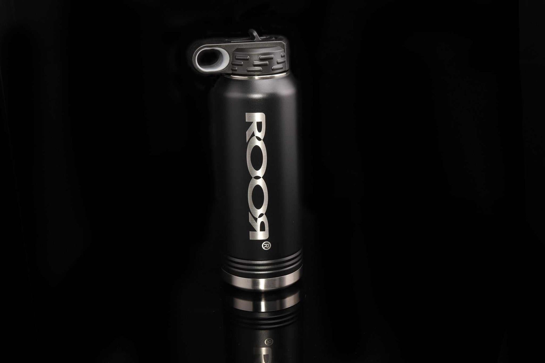 ROOR Water Bottle 32oz with black exterior and silver logo on a dark background.