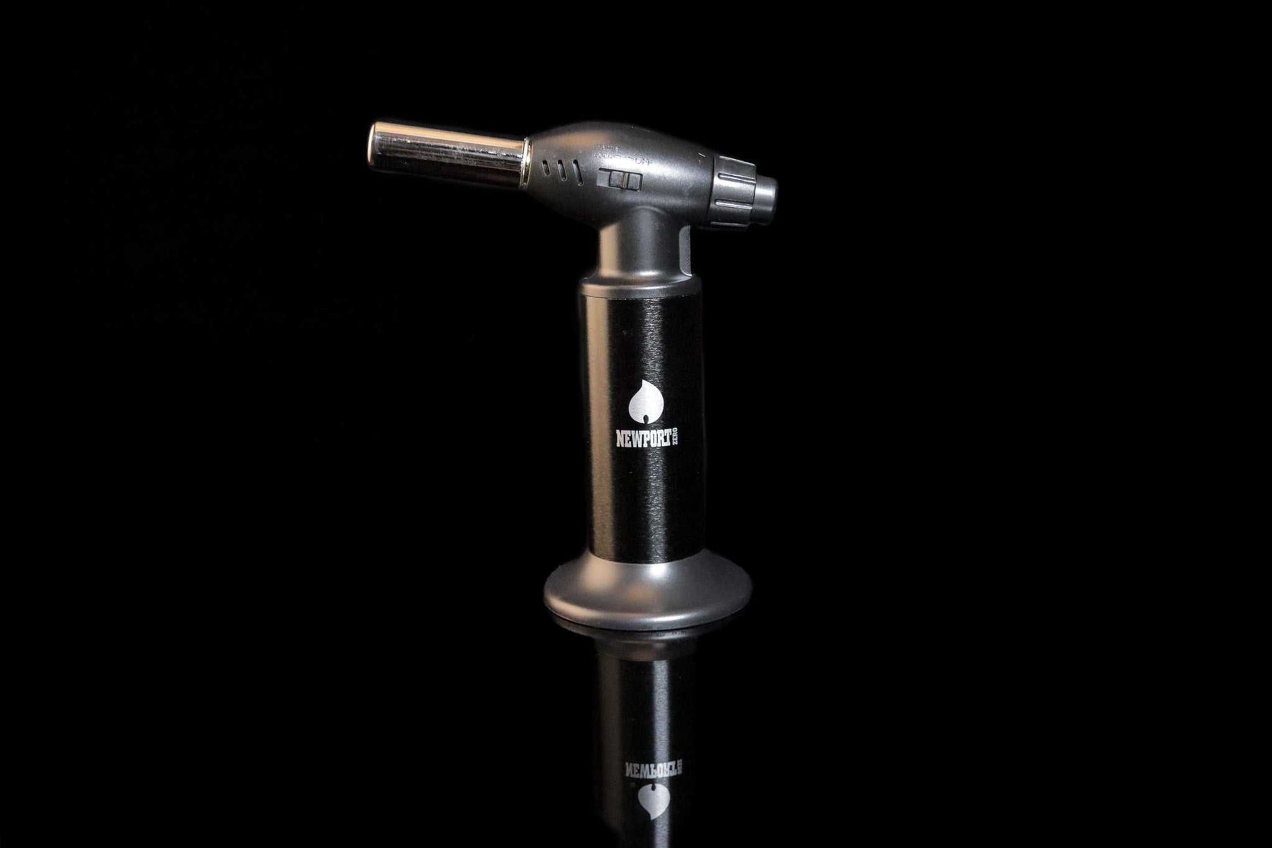 Newport Zero black jumbo butane torch with ergonomic design on black background