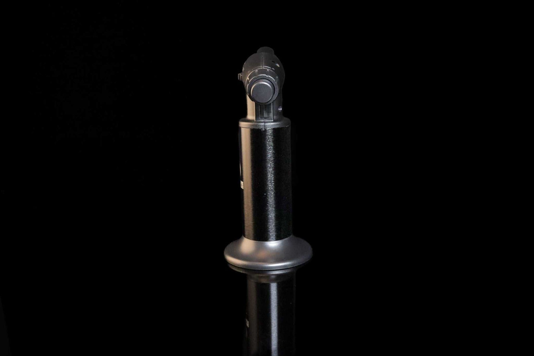 Newport Zero Jumbo Butane Torch with ergonomic design and safety lock system on black background