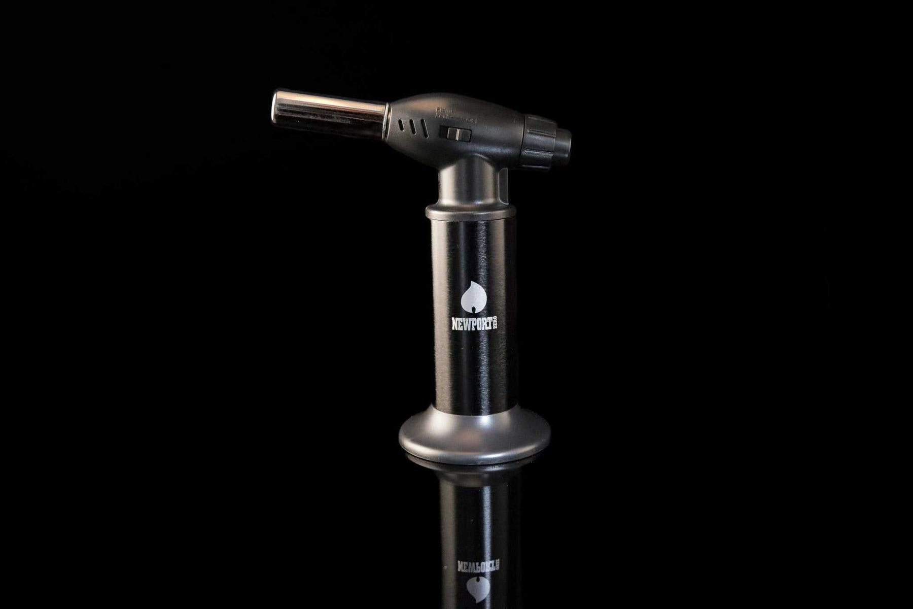 Newport Zero Jumbo Butane Torch with ergonomic design and safety lock on black background