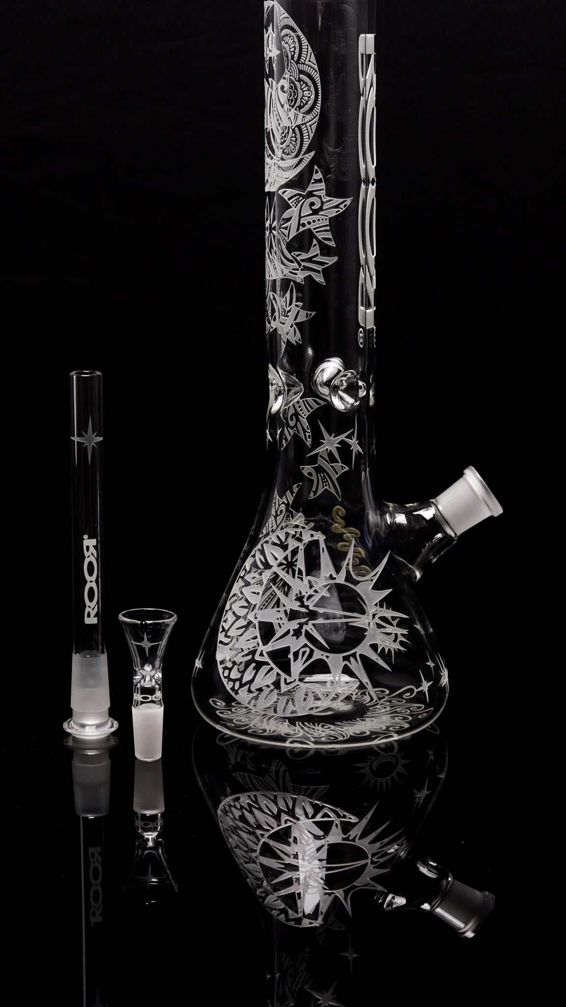 ROOR® Sandblasted 14" Beaker glass bong with intricate sun and star design on black background