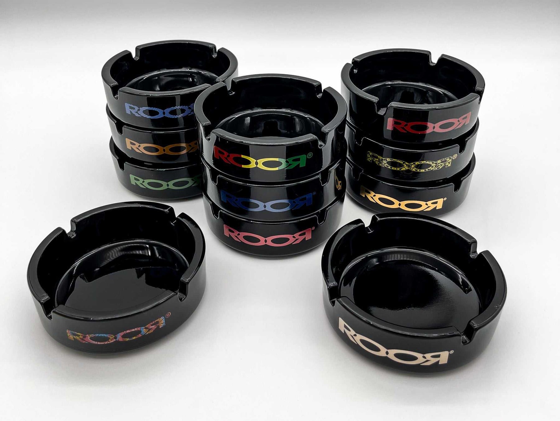 Black ROOR glass ashtrays with various colored decals, limited edition collector's item.