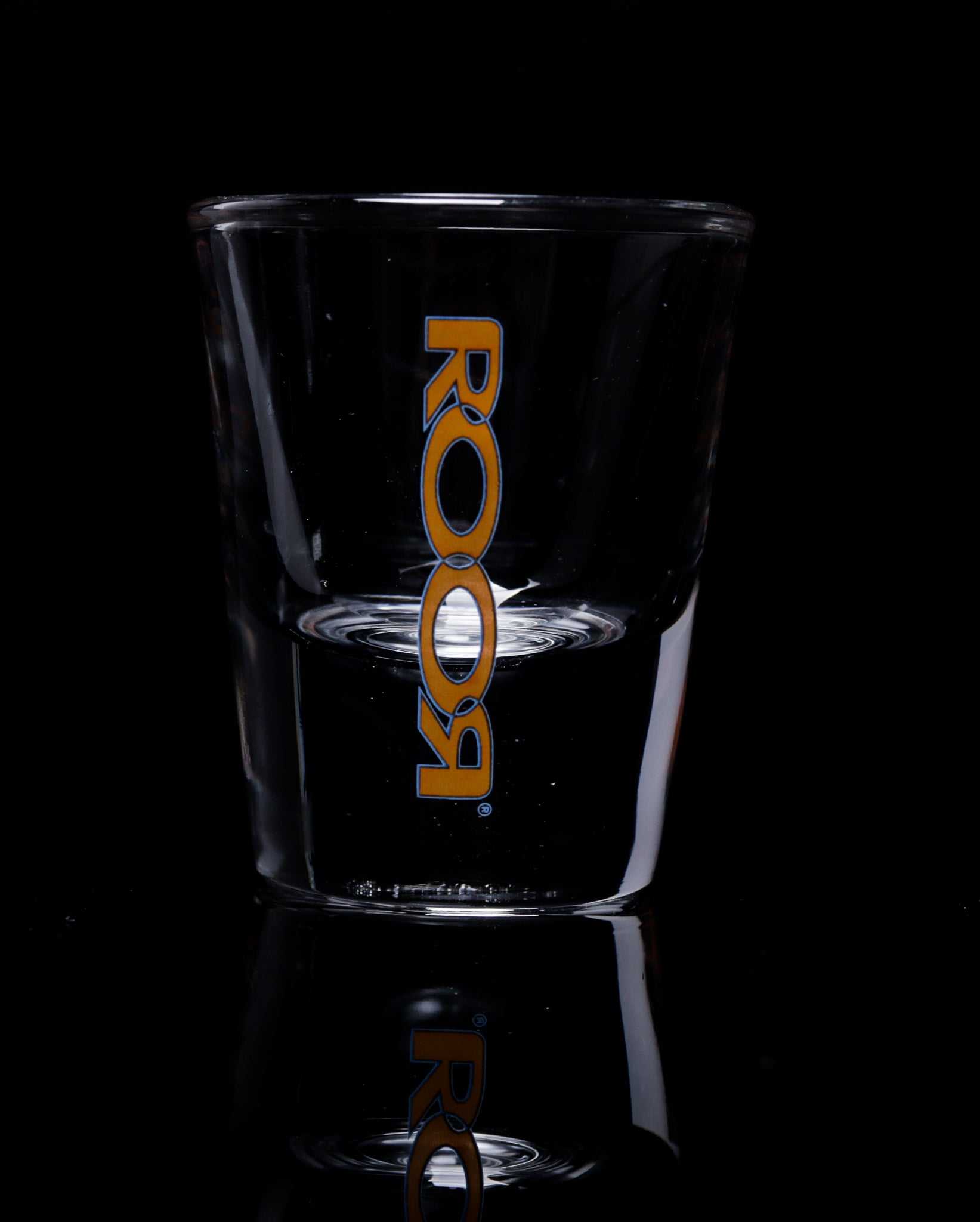 ROOR Shot Glass with thick clear base and assorted decals.