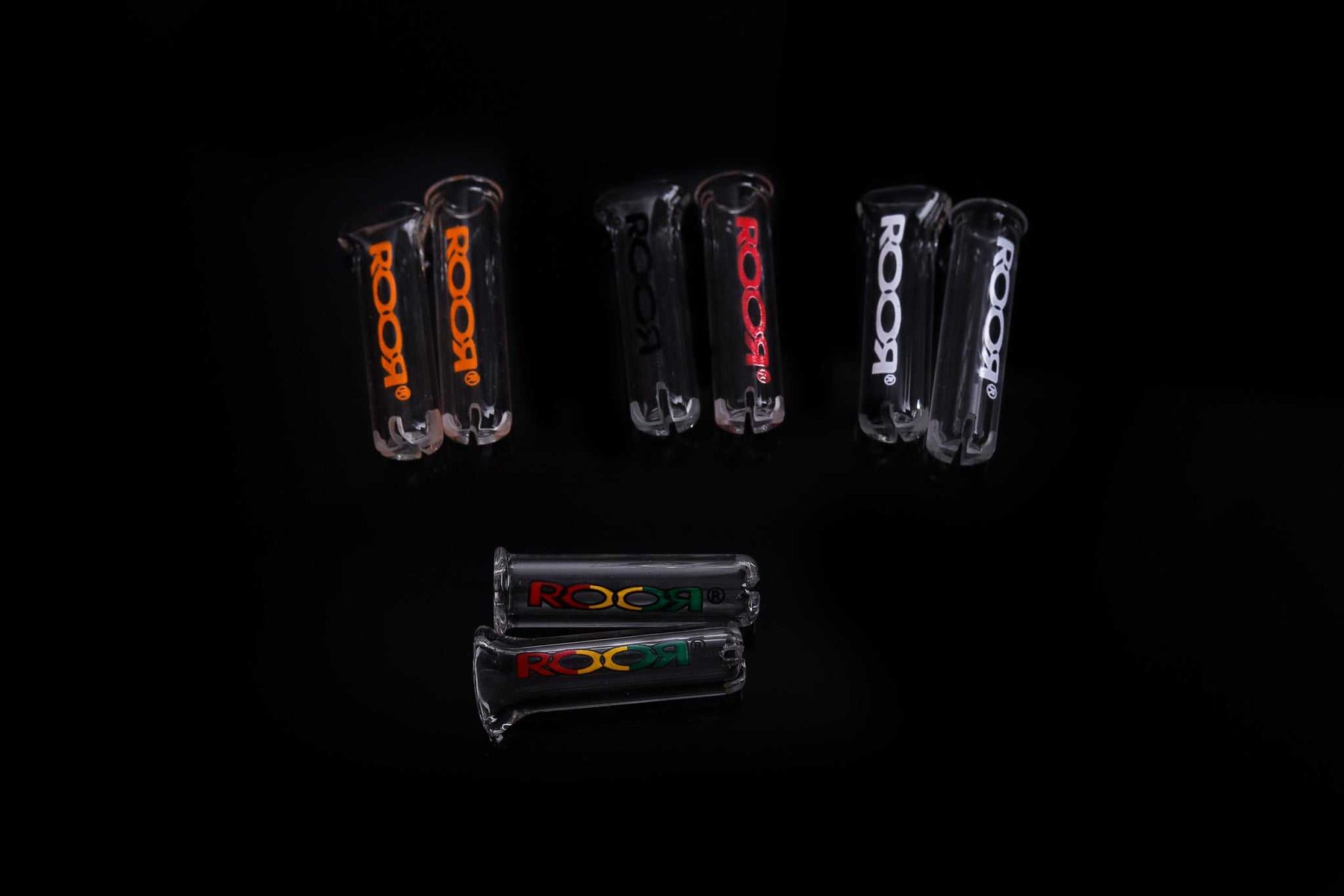ROOR Plus Tip 8mm Single glass tips with assorted decal colors on a black background.