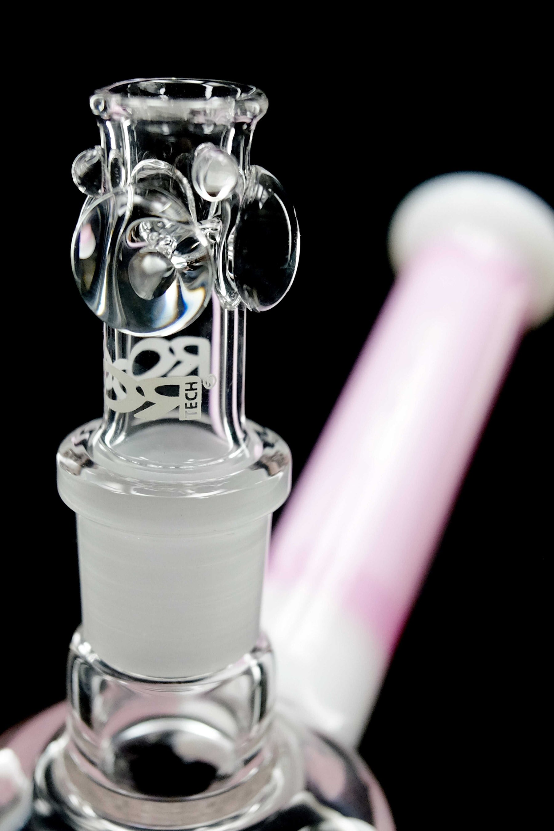 Close-up of ROOR® Tech Fixed 10-Arm Tree Bubbler in pink and white with clear glass joint and 10-arm percolator design