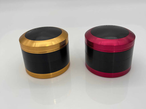 SHARPSTONE® HARD TOP 4 PIECE GRINDER - 2.5", gold and red anodized aluminum grinder with smooth finish and sharp diamond cutting blades.