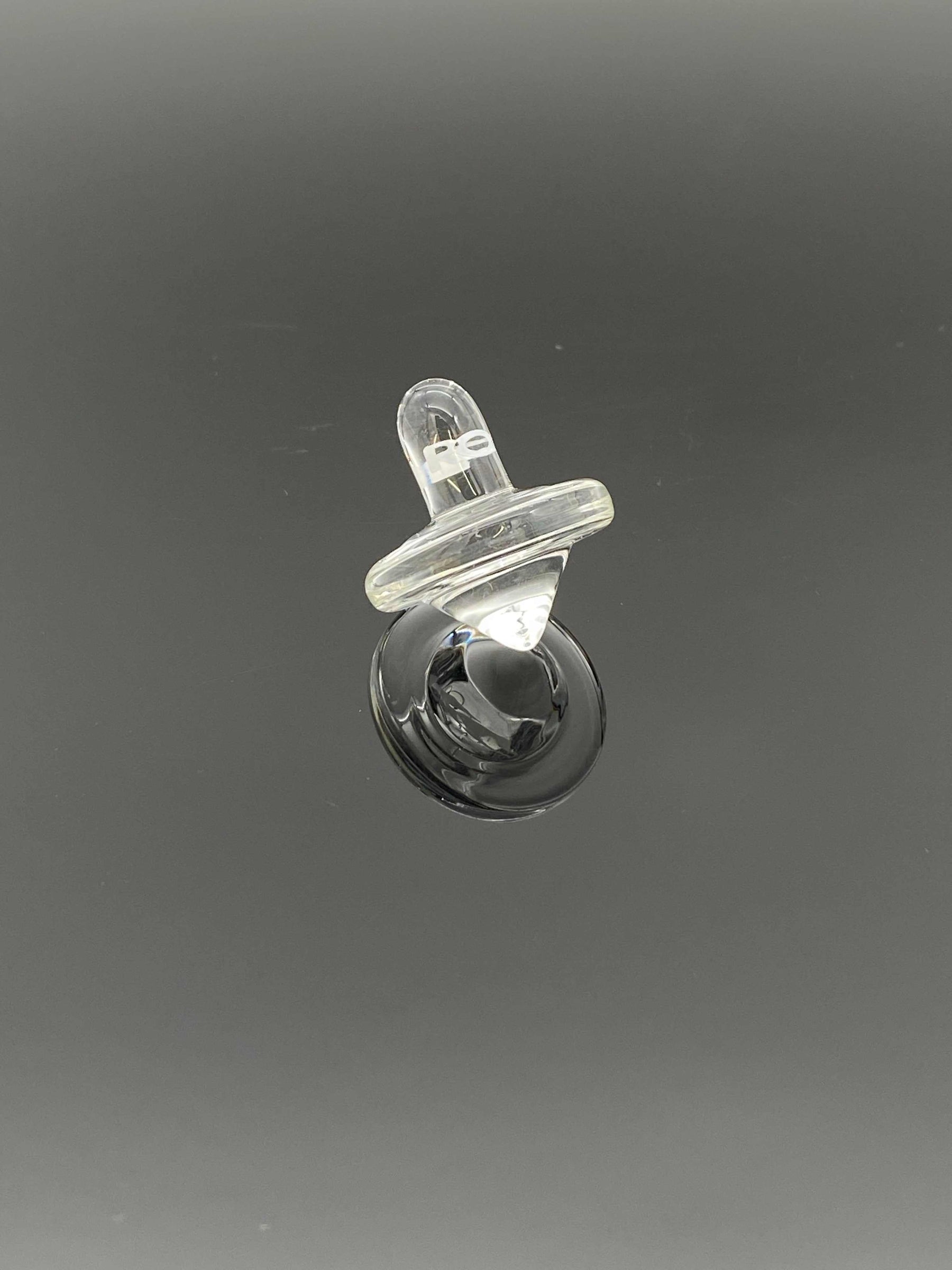 ROOR® Glass Spinning Top Carb Cap on black background.