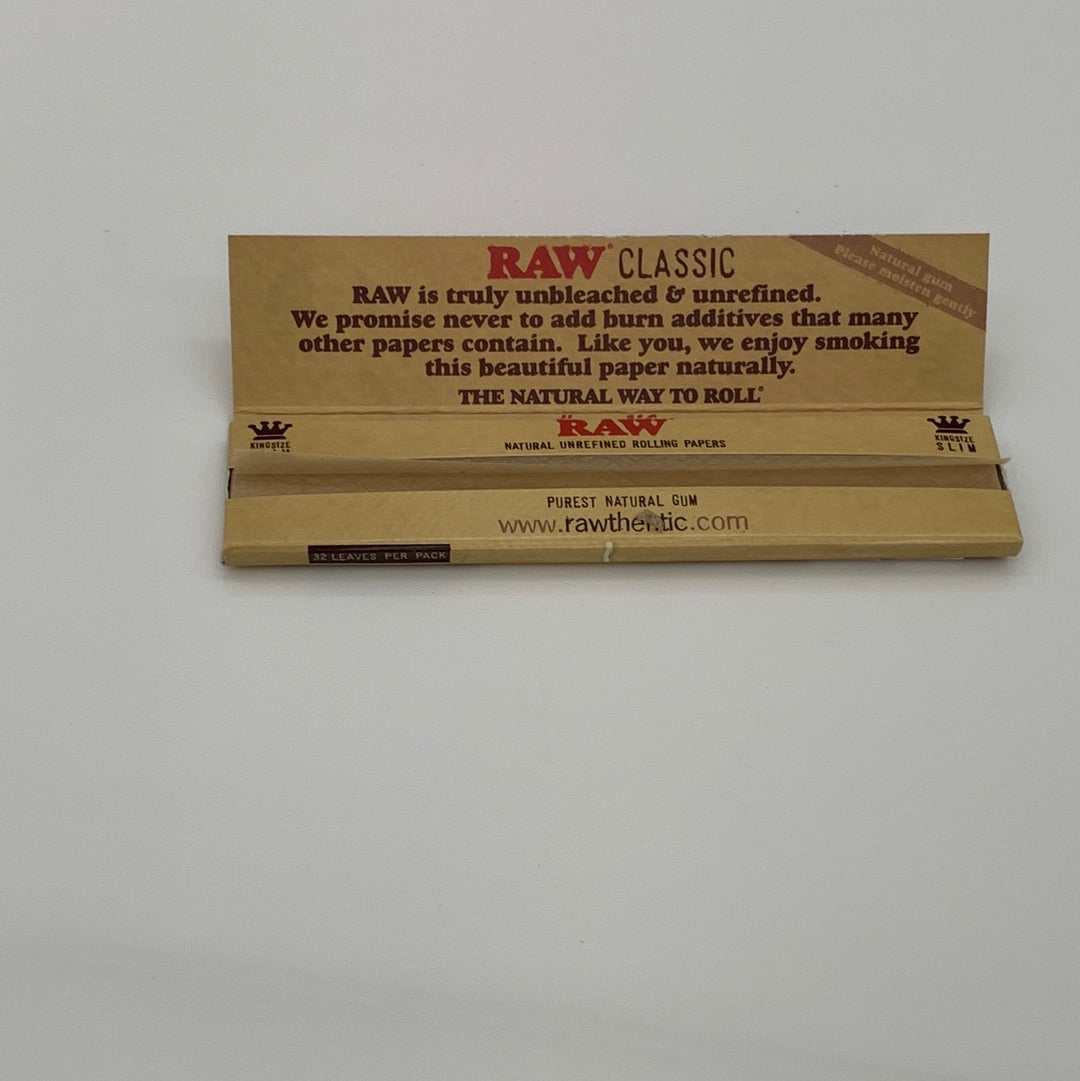 RAW Classic King Size Slim rolling paper brown pack opened showing natural unbleached, additive-free papers