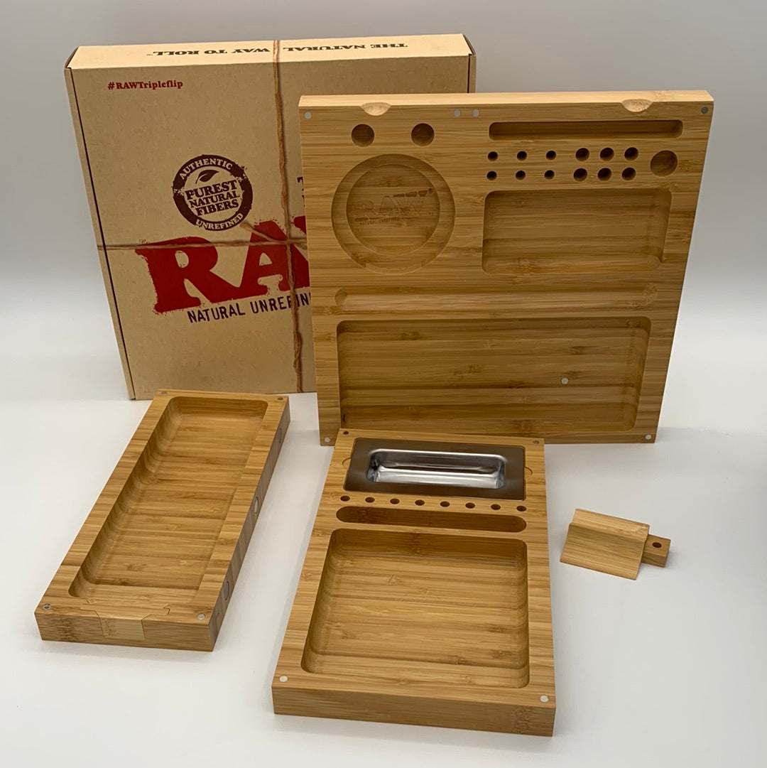 RAW Triple Flip Rolling Tray with multiple wooden panels, magnetic locking system, and integrated ashtray displayed with packaging box