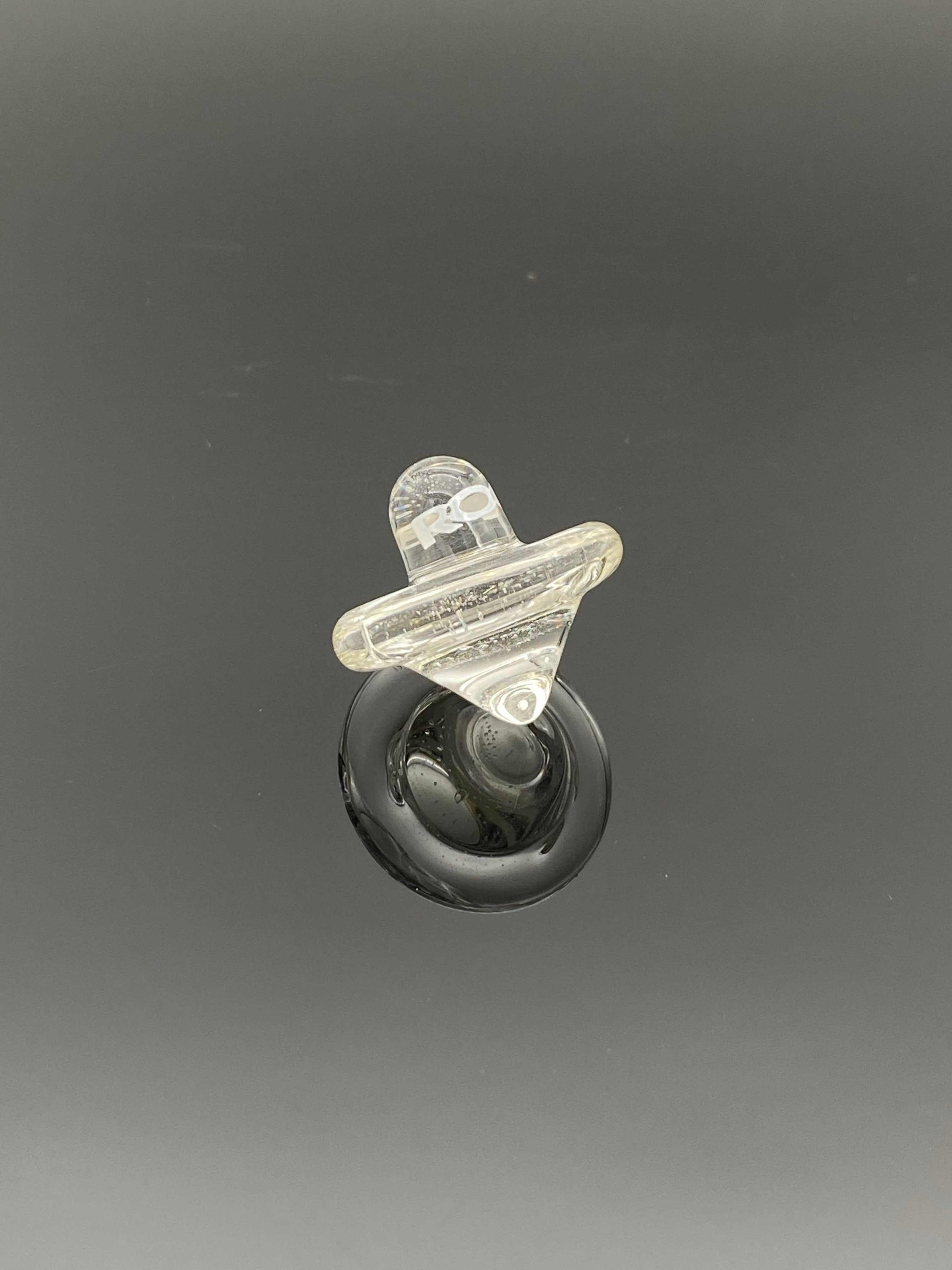 ROOR® Glass Spinning Top Carb Cap with handcrafted design on a black background.