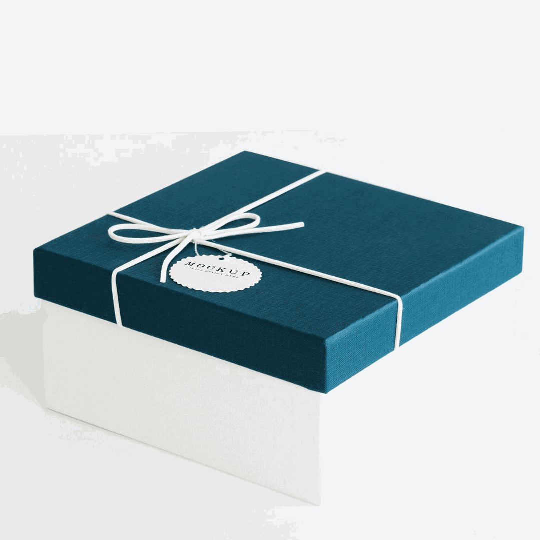 Blue gift box with white ribbon and tag, showcasing professional gift packaging.
