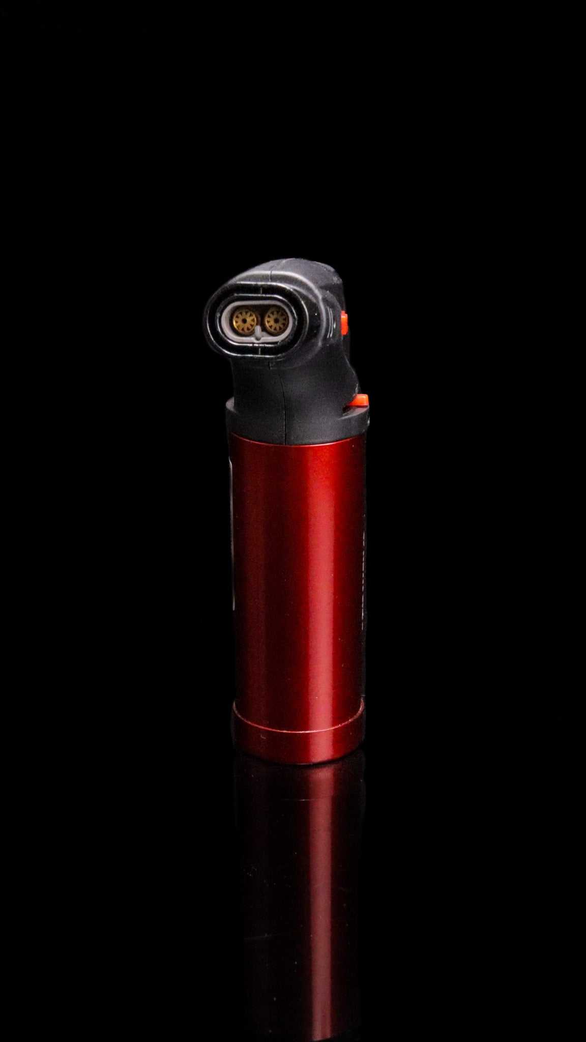 Red Newport Zero Micro Torch with auto ignition and extended burner head on black background