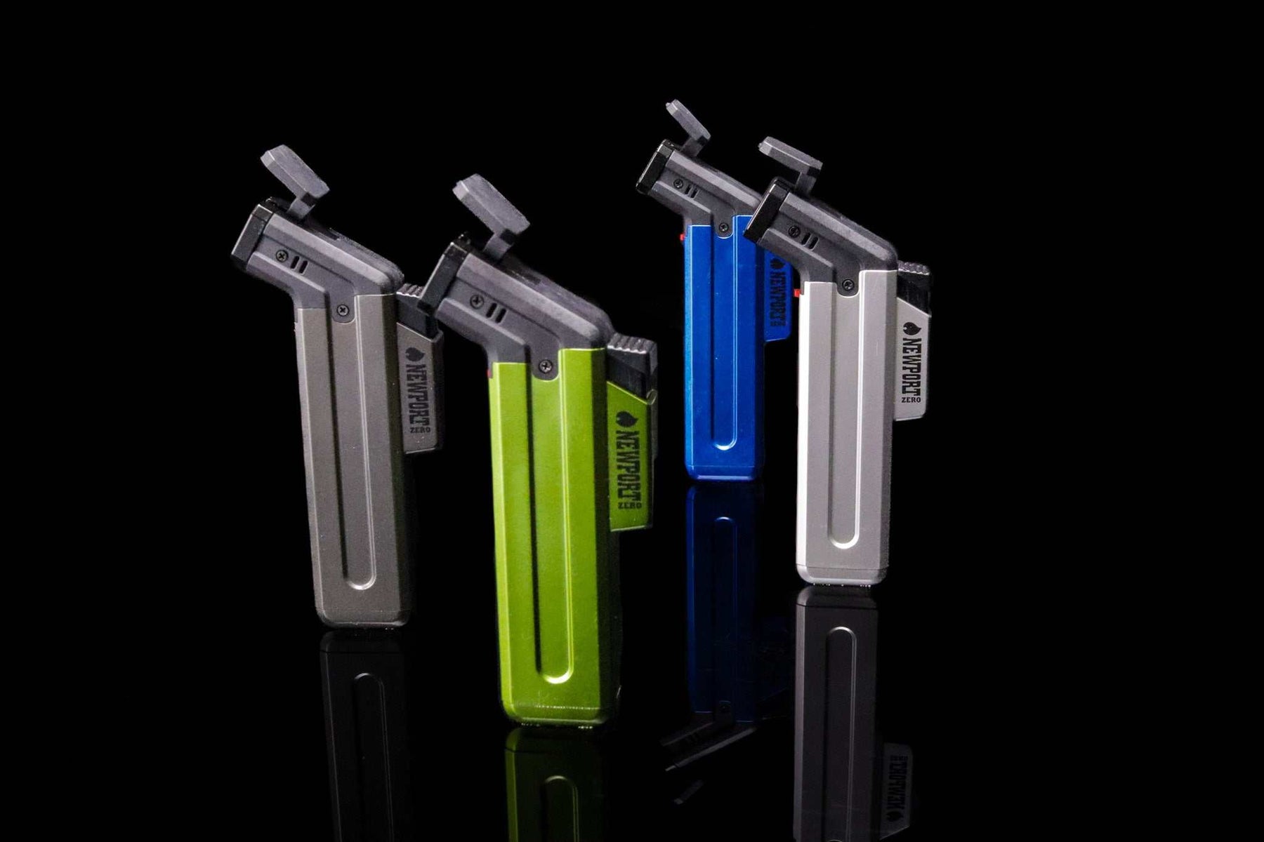 Colorful Newport Zero metallic lighters on black background.