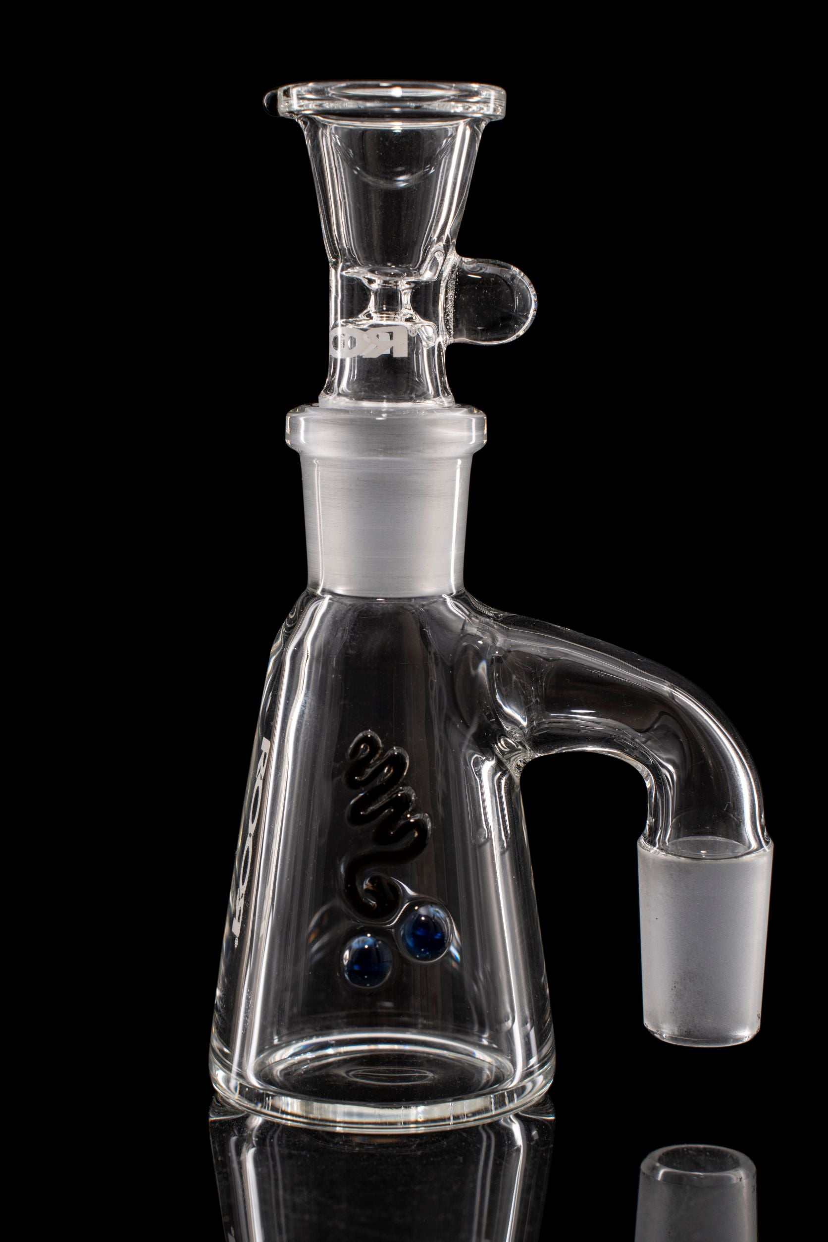 Clear ROOR® Debris Catcher glass accessory with angled arm and joint connection against black background